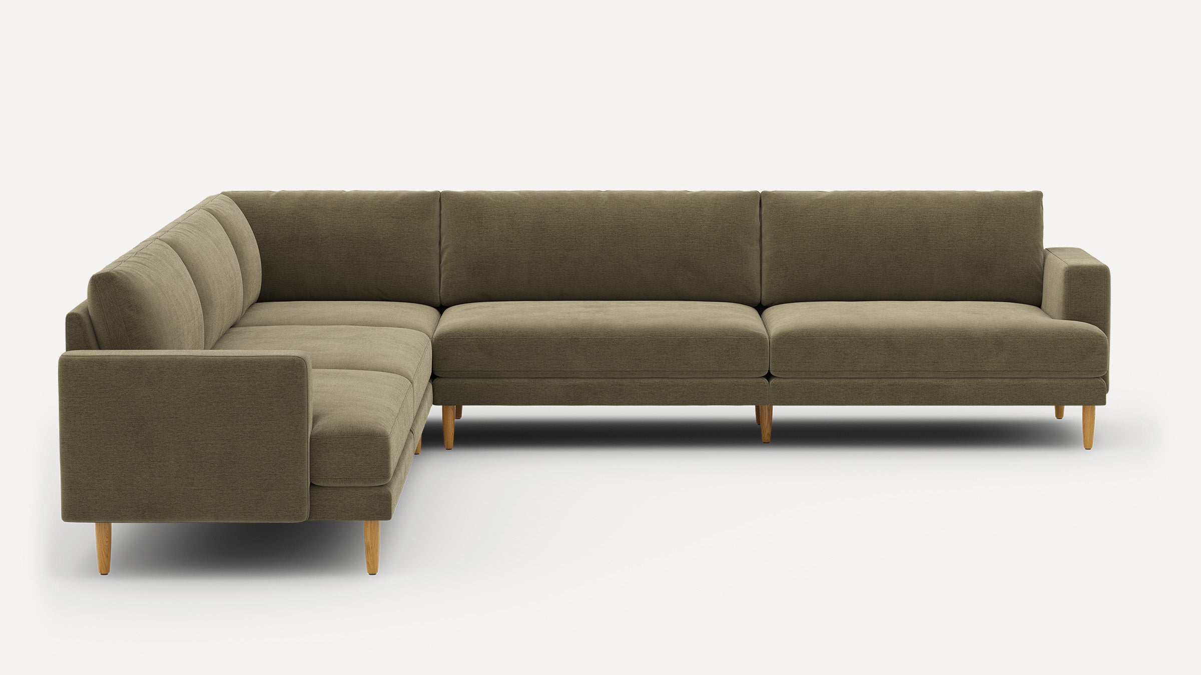 L-shaped sectional sofa with olive green fabric upholstery, clean lines, cushioned seats, and light wooden tapered legs.