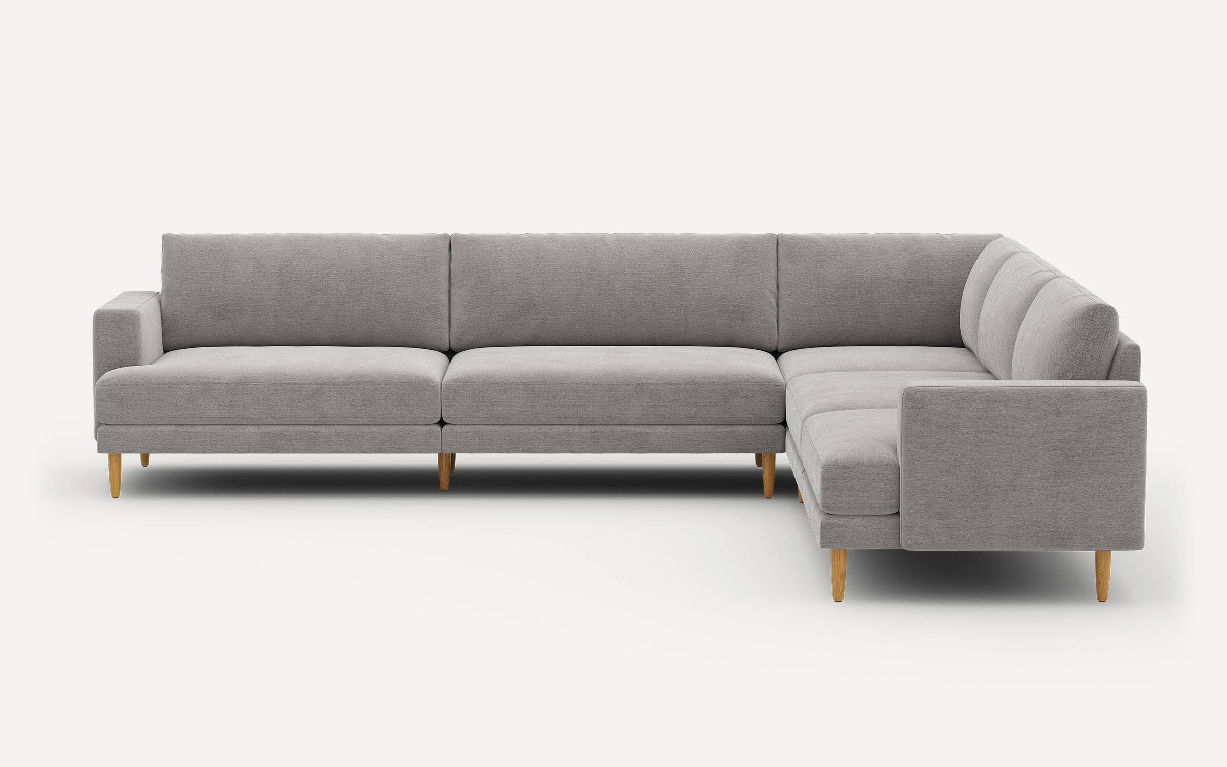 Modern light gray L-shaped sectional sofa with wooden legs and clean, minimalist design.