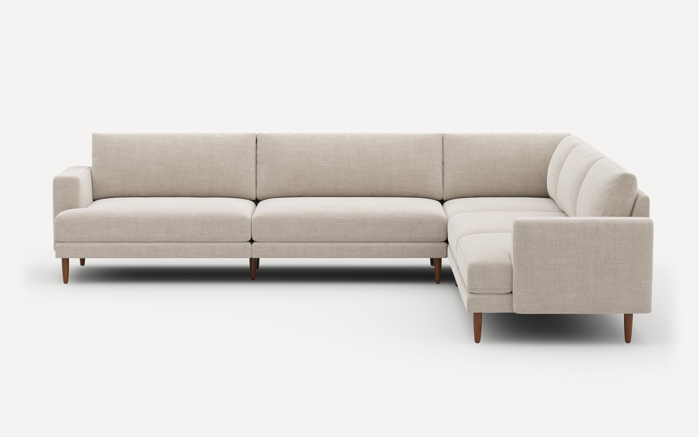 Beige L-shaped modern sectional sofa with wooden legs, featuring clean lines and cushioned seats and backs.