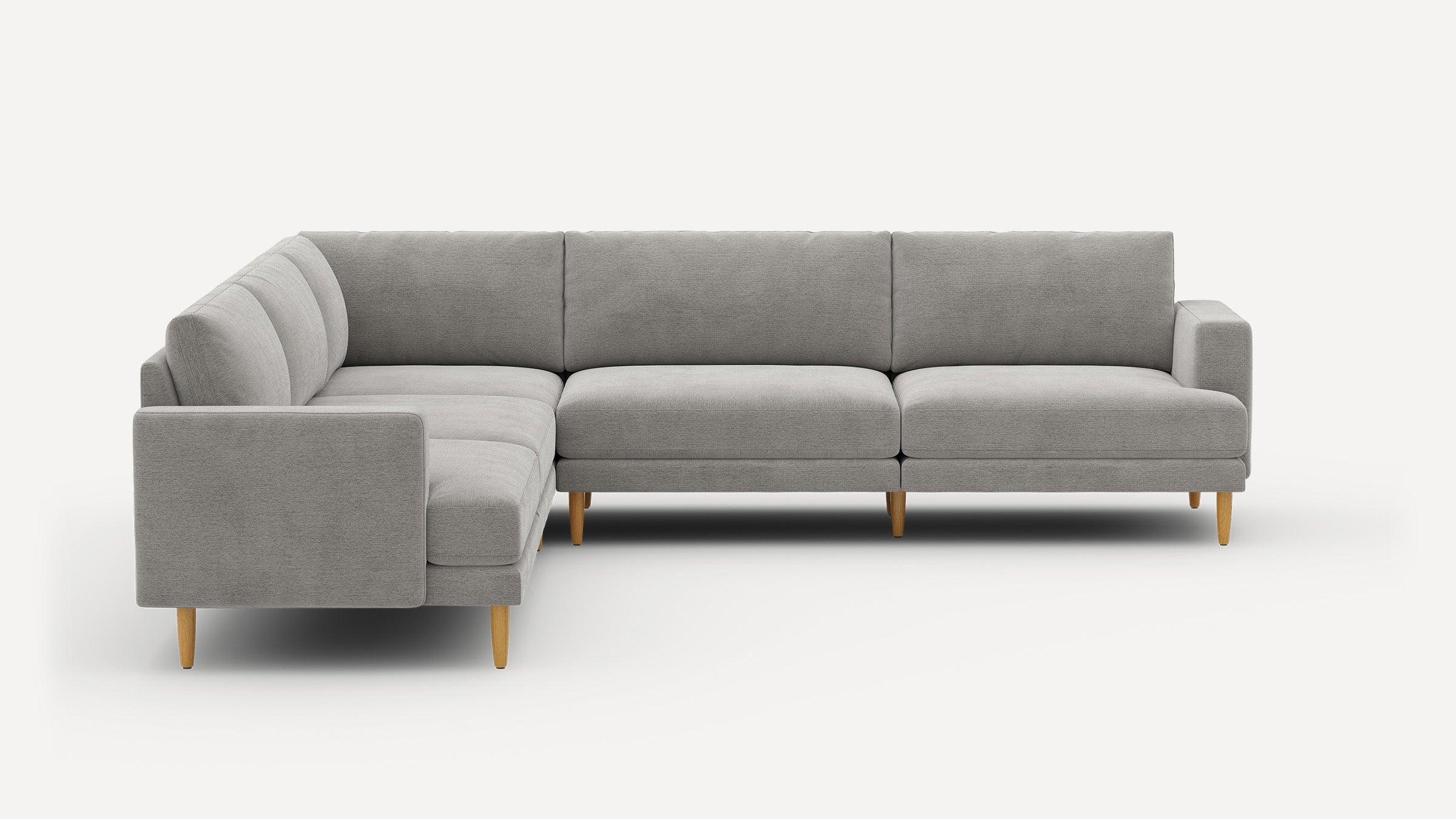 Modern L-shaped sectional sofa with light gray upholstery and wooden tapered legs against a white background.