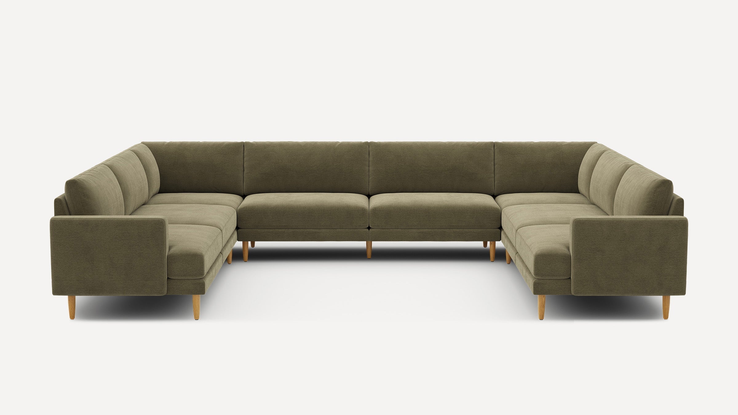 Large U-shaped sectional sofa in olive green fabric with cushioned seats and backs, supported by light wooden legs.