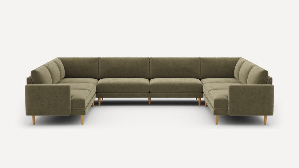 Large U-shaped sectional sofa with olive green fabric upholstery and wooden legs, modern minimalist design.