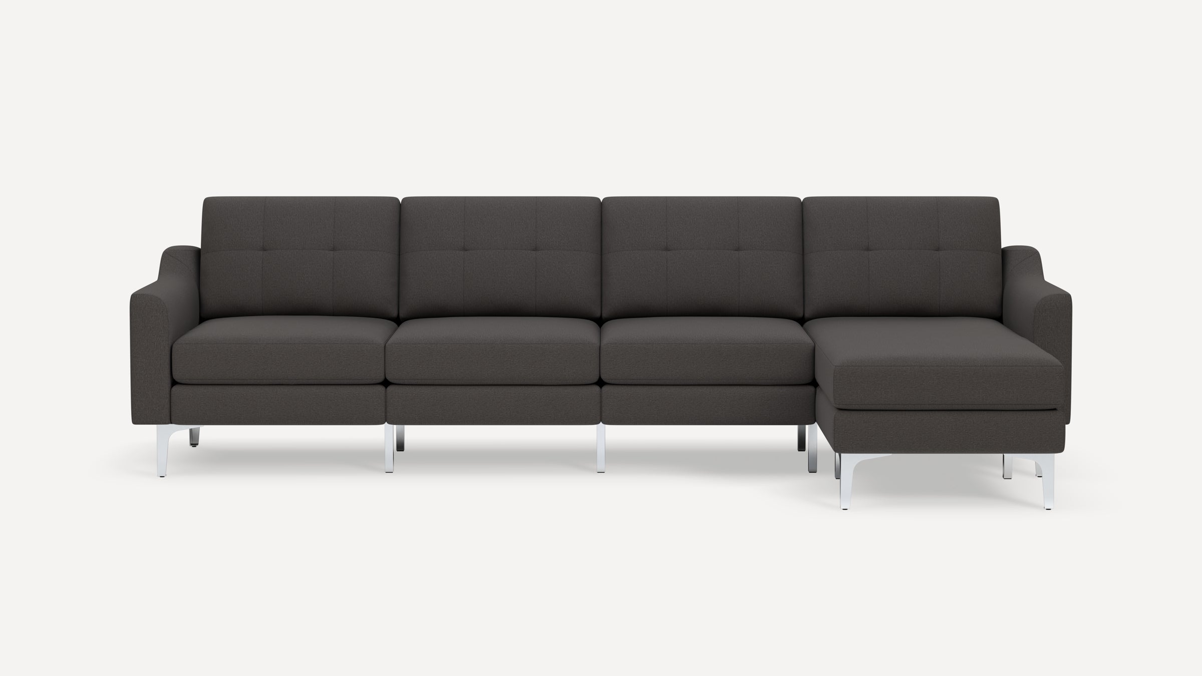 Modern dark gray sectional sofa with tufted back cushions, metal legs, and a right-side chaise lounge.