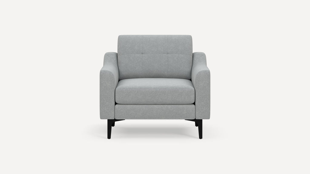 Modern light gray upholstered armchair with padded seat, backrest, and black metal legs on a white background.