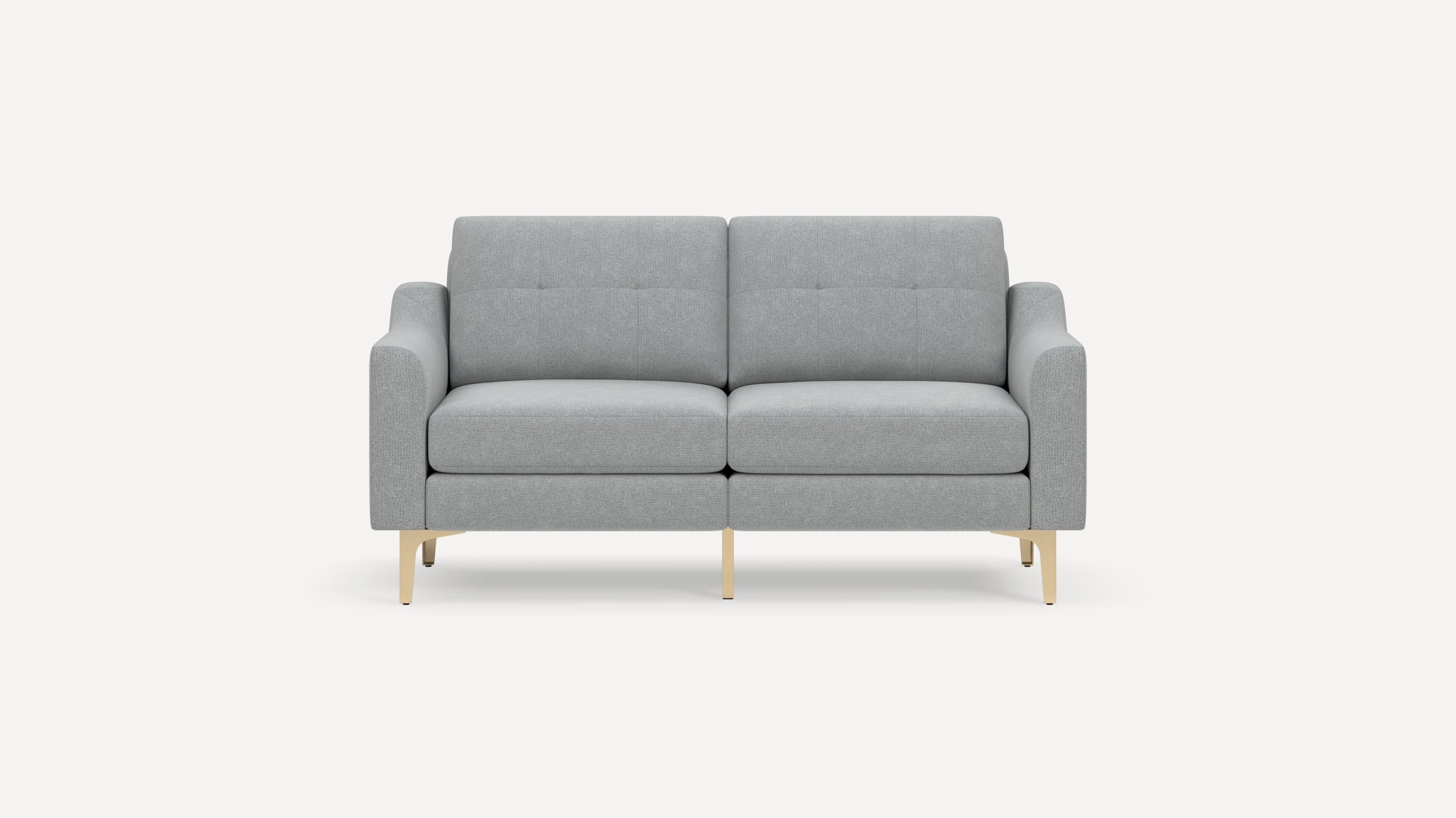 Modern light gray two-seater sofa with button-tufted backrest and slim beige metal legs on a white background.