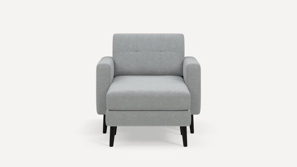 Front view of a modern light gray upholstered armchair with black wooden legs and minimalistic design.