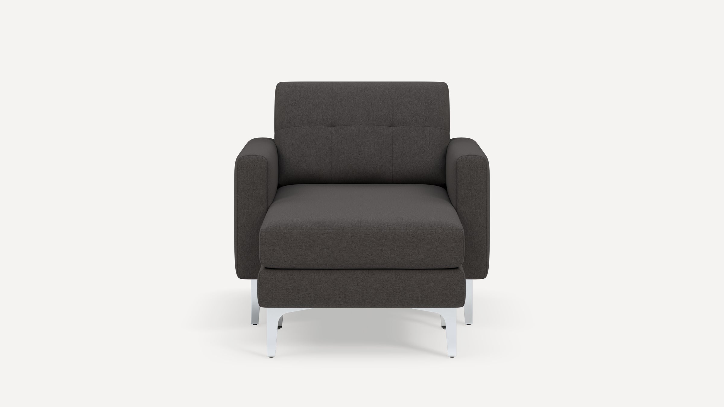 Front view of a dark gray modern armchair with tufted backrest and silver metal legs on a white background.