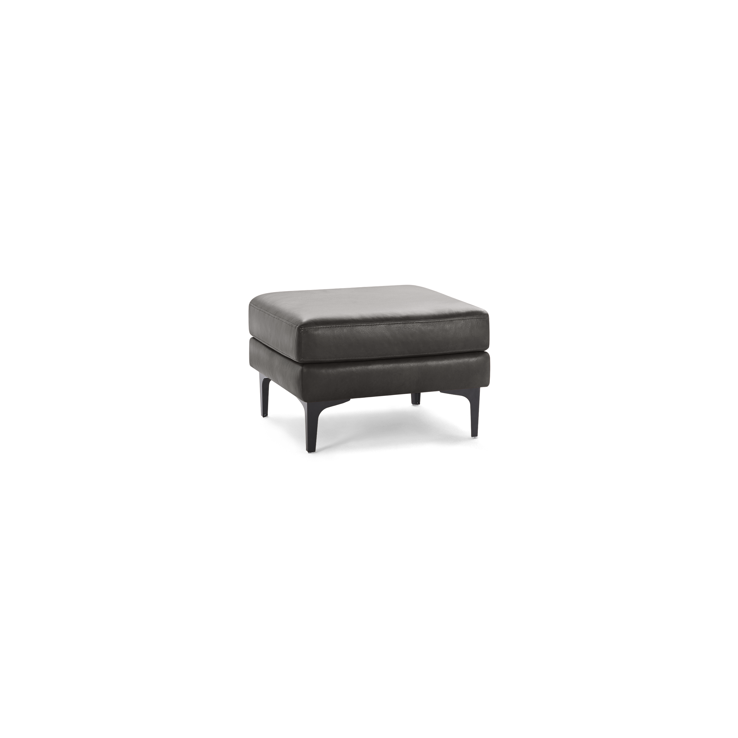 Square dark gray leather ottoman with cushioned top and slim black metal legs on a black background.