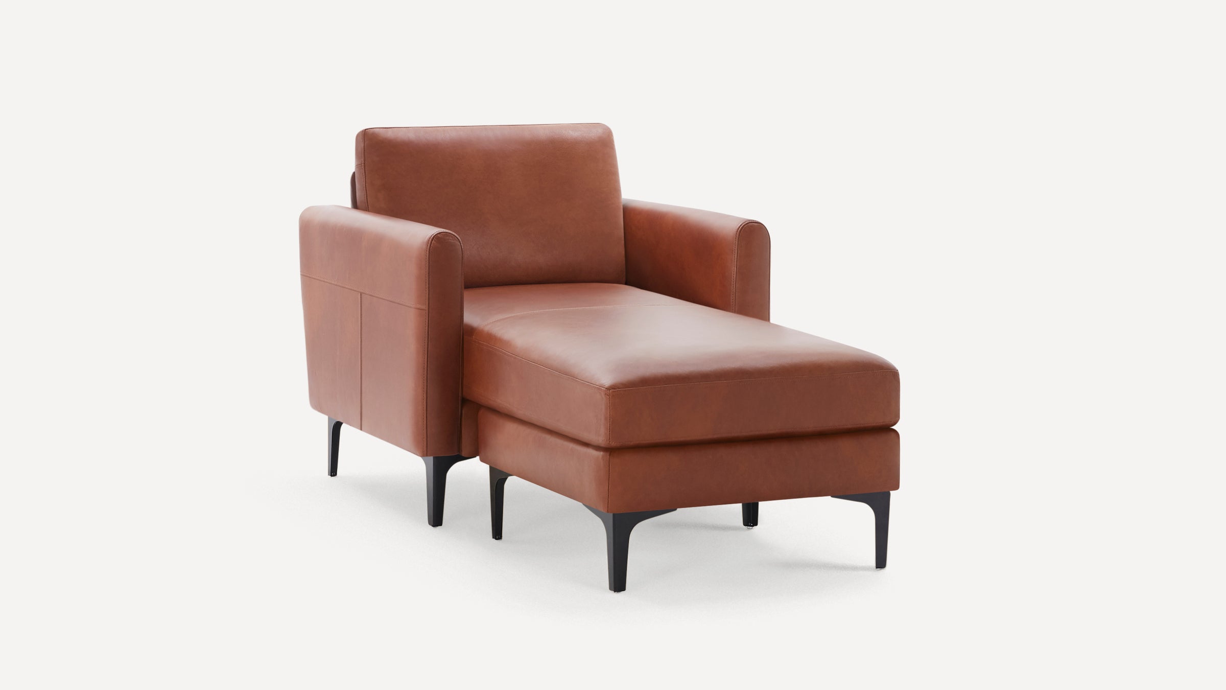 Brown leather chaise lounge with a cushioned backrest, armrests, and black metal legs on a white background.