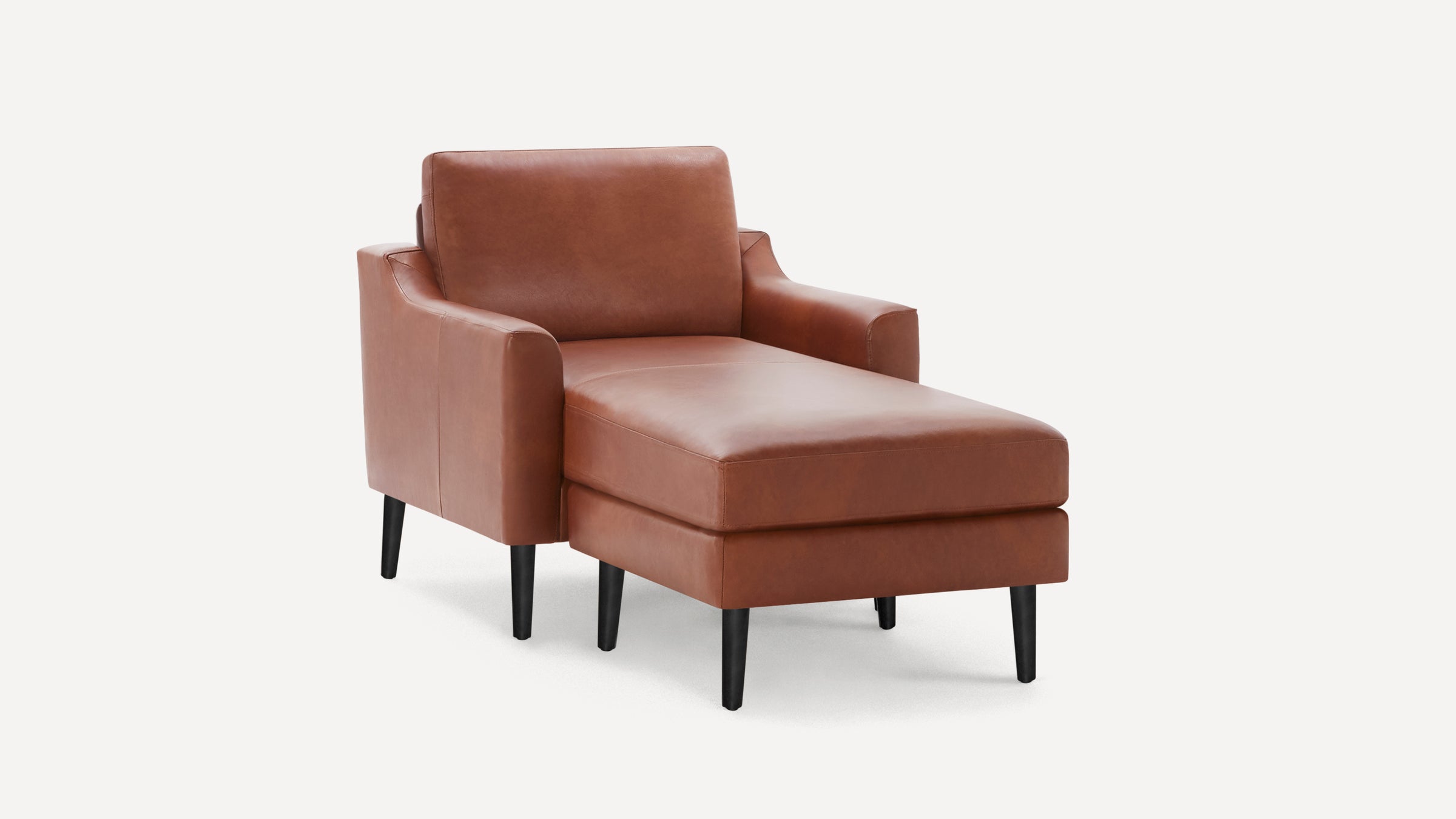 Modern brown leather chaise lounge chair with black tapered wooden legs and padded armrests, shown on white background.