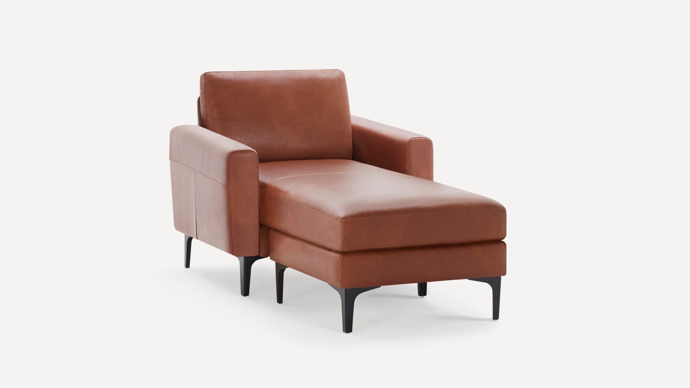 Modern brown leather chaise lounge with armrests and black tapered legs on a white background.