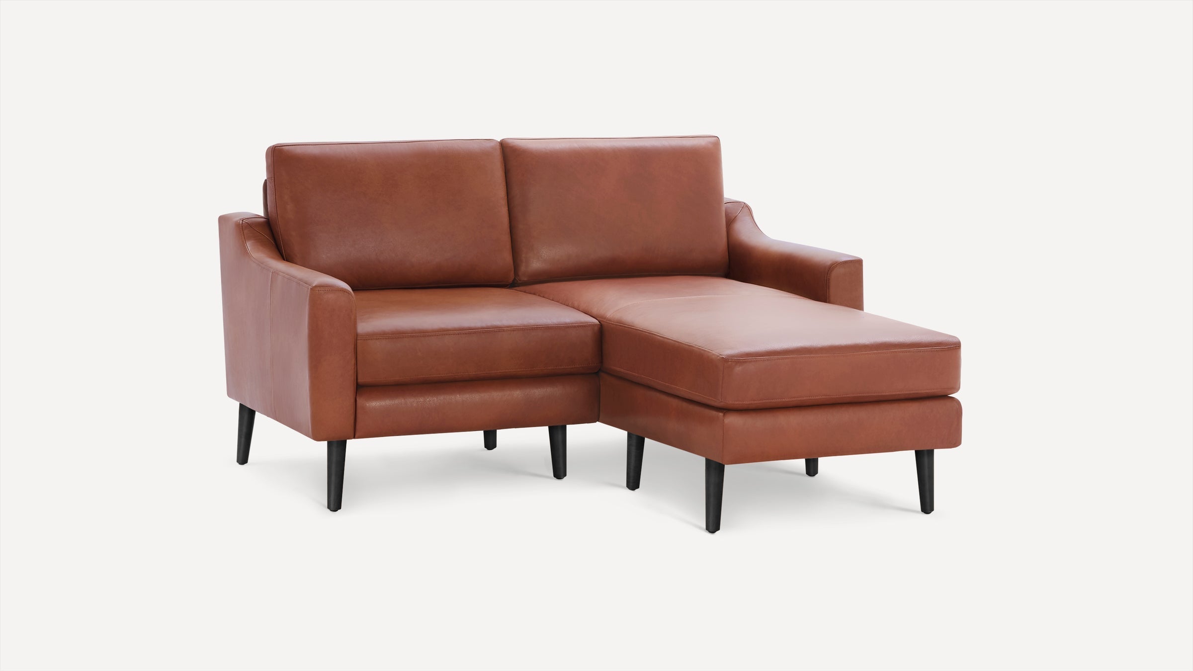 Modern brown leather sectional sofa with sleek black legs and a right-side chaise lounge on a white background.