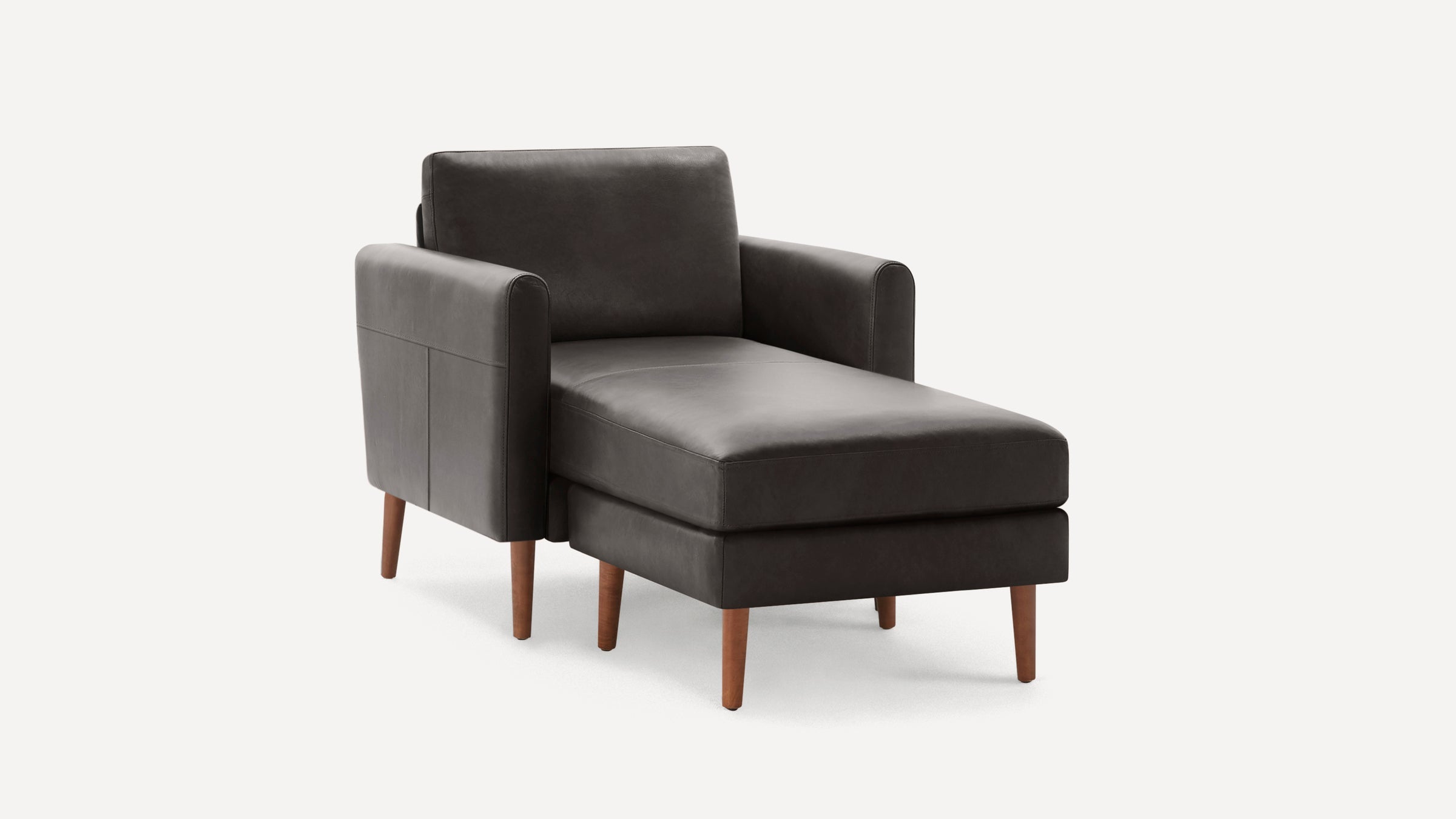Dark gray leather chaise lounge chair with wooden tapered legs and armrests, featuring a cushioned seat and backrest.