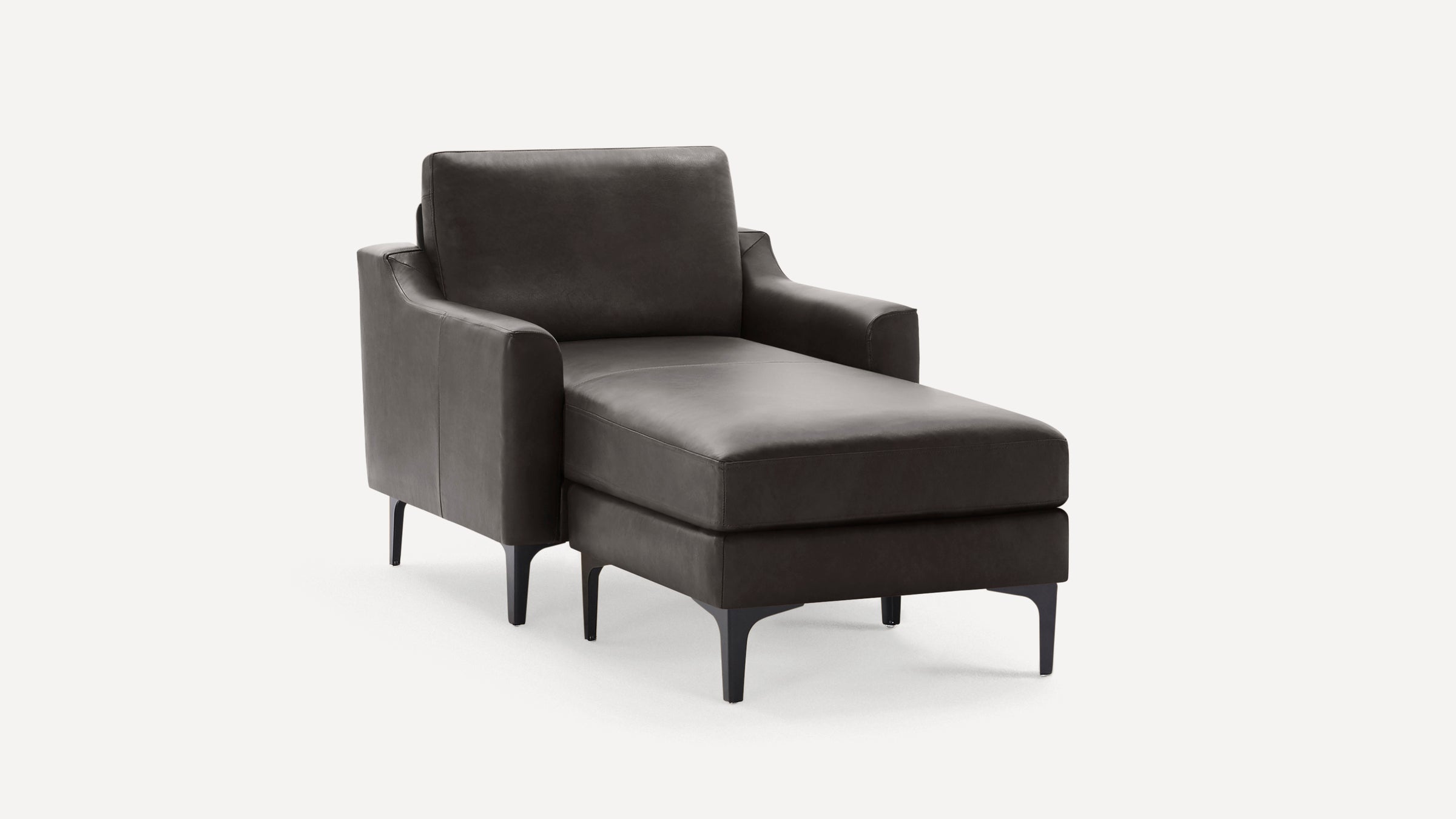 Dark gray modern chaise lounge with sleek armrests, cushioned seat, and black tapered legs on white background.