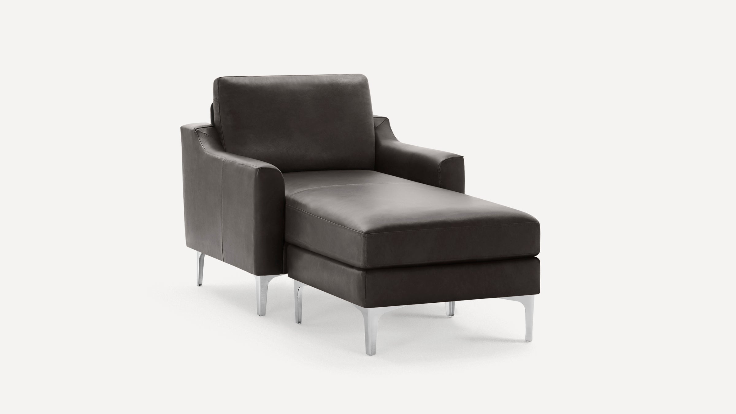 Modern dark gray leather chaise lounge chair with sleek metal legs and cushioned armrests, shown on a white background.