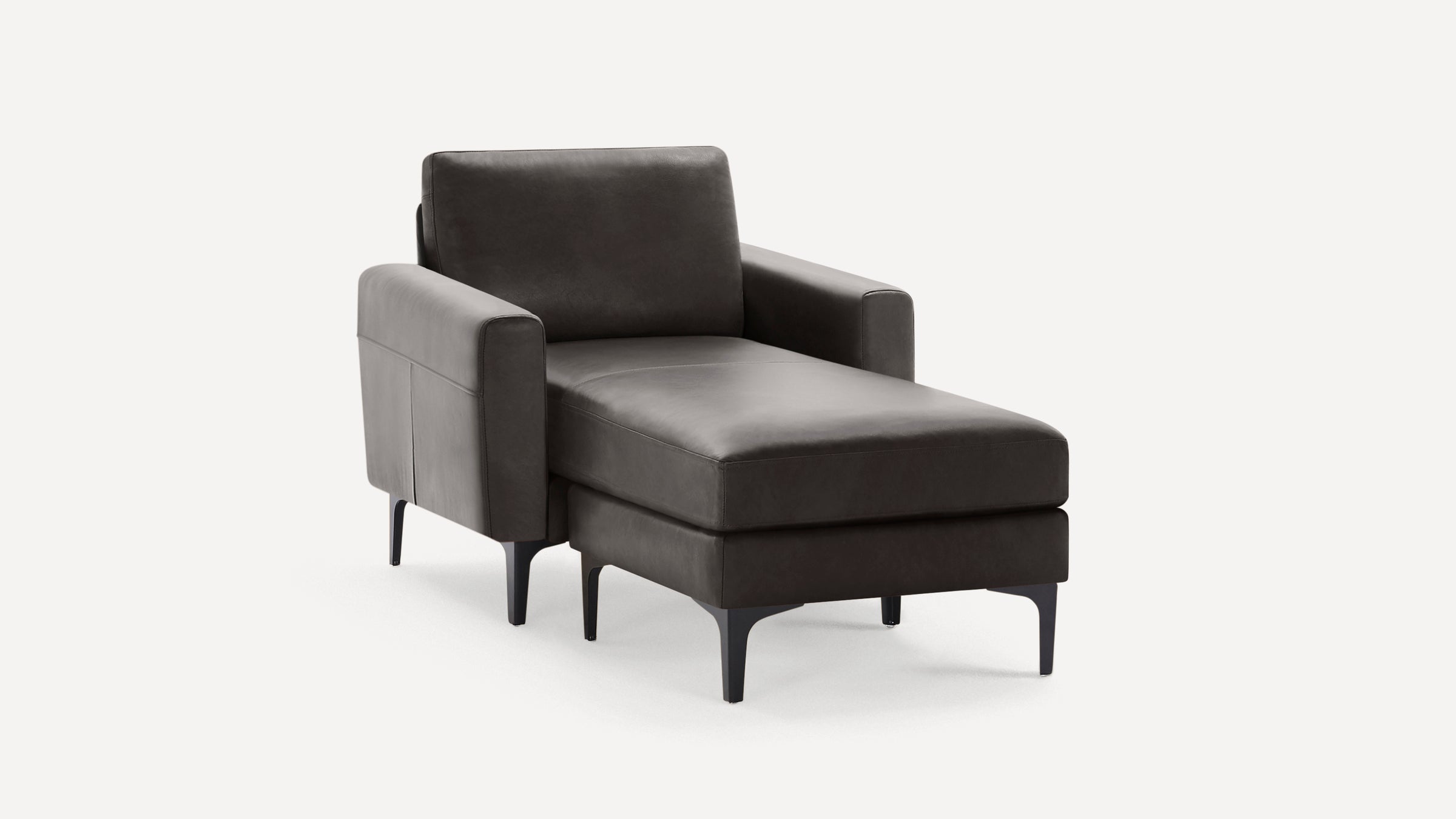 Dark gray modern chaise lounge chair with sleek armrests, cushioned seat, and black metal legs, isolated on white background.