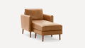 Mid-century modern tan leather chaise lounge with wooden tapered legs and armrests on a white background.