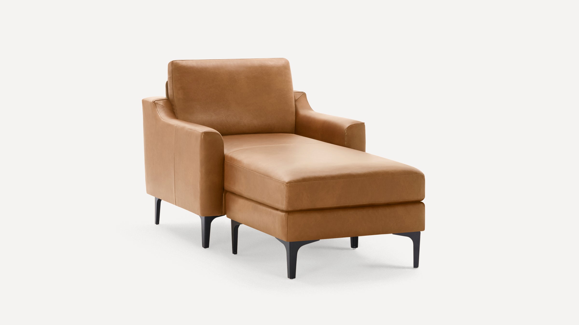 Tan leather chaise lounge with straight arms, cushioned seat, and black tapered legs on white background.