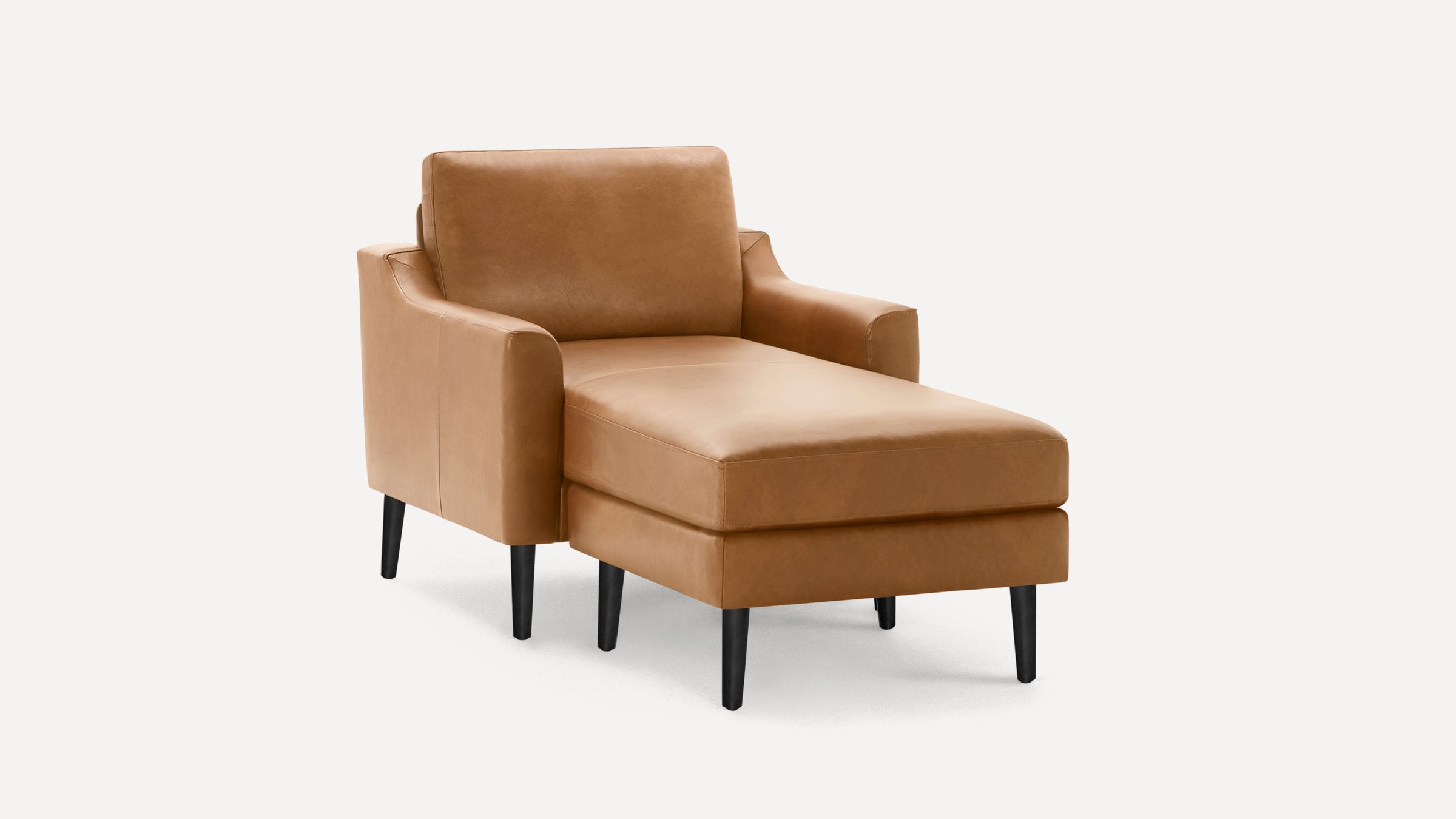 Modern tan leather chaise lounge chair with black tapered wooden legs and cushioned armrests on both sides.