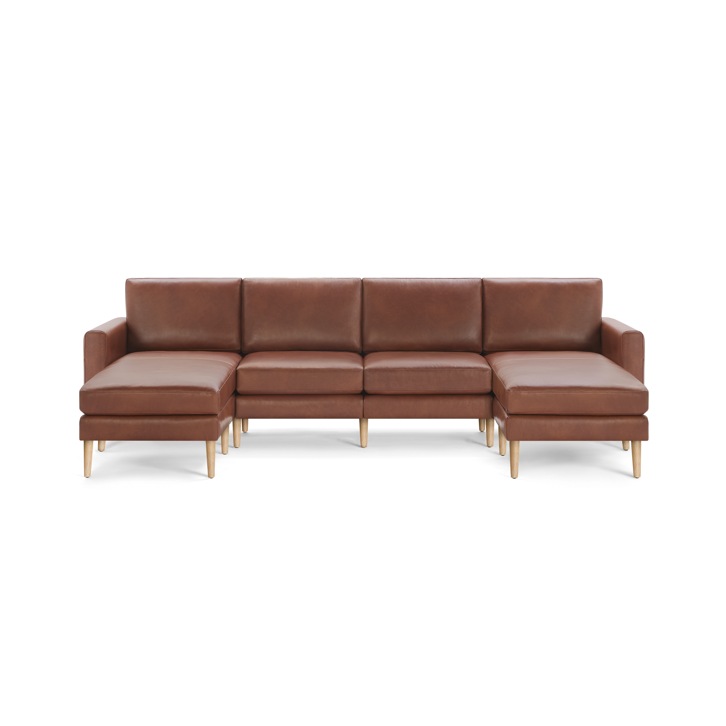 Large brown leather sectional sofa with wooden legs and chaise lounges on both ends, offering modern and spacious seating.
