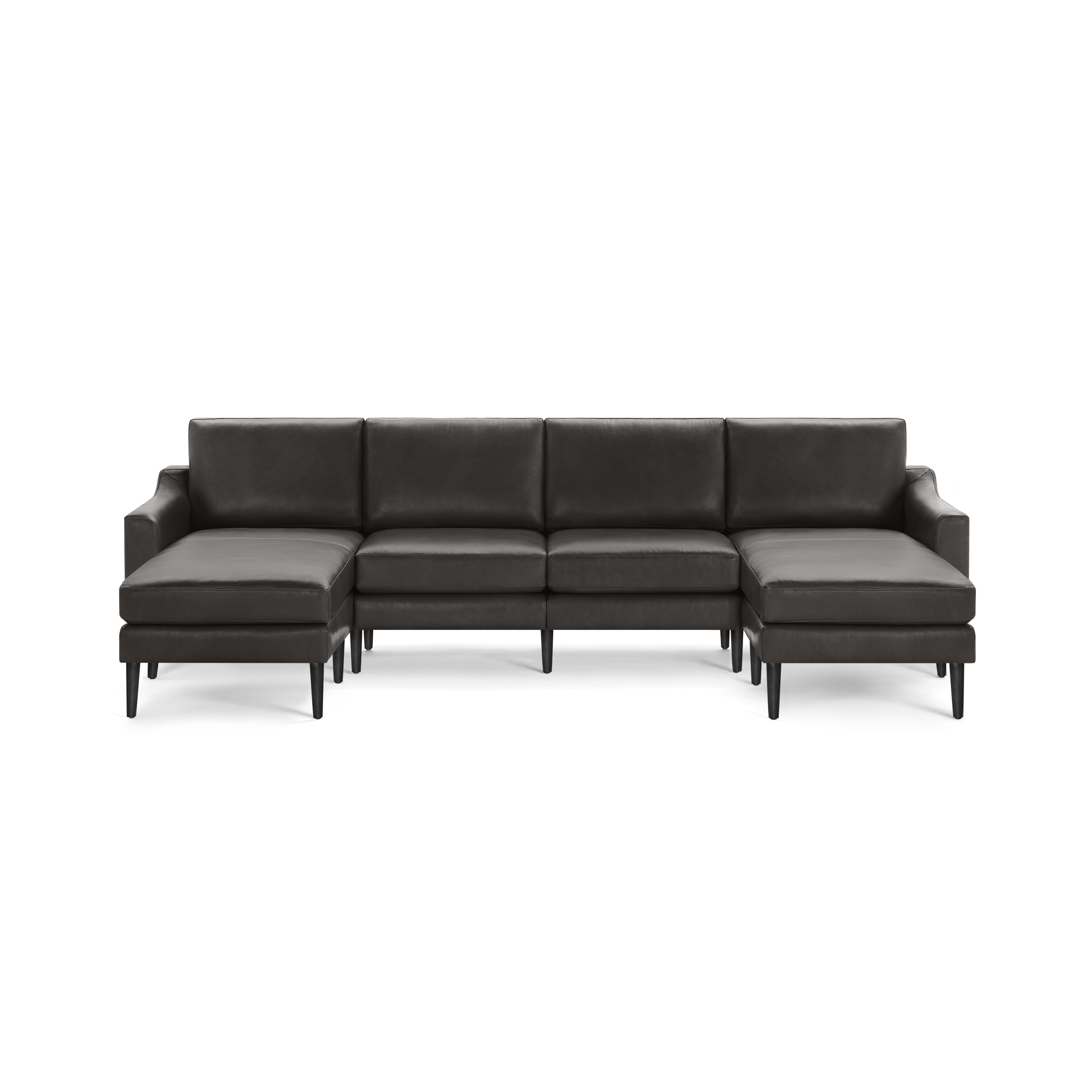 Large dark gray leather sectional sofa with chaise lounges on both ends and slim black legs, designed for modern living rooms.