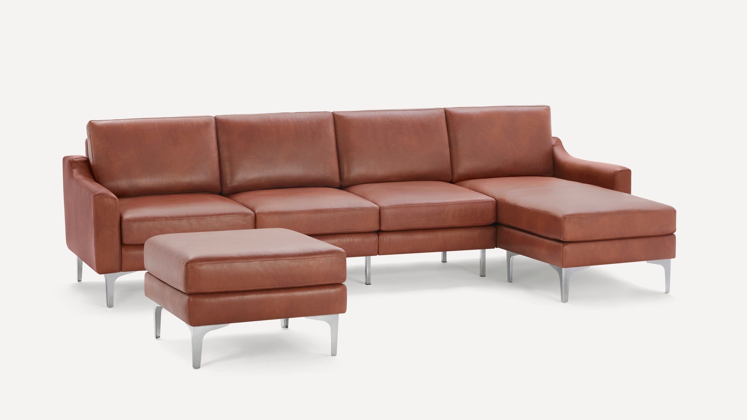 Modern brown leather sectional sofa with metal legs and a matching ottoman on a plain white background.