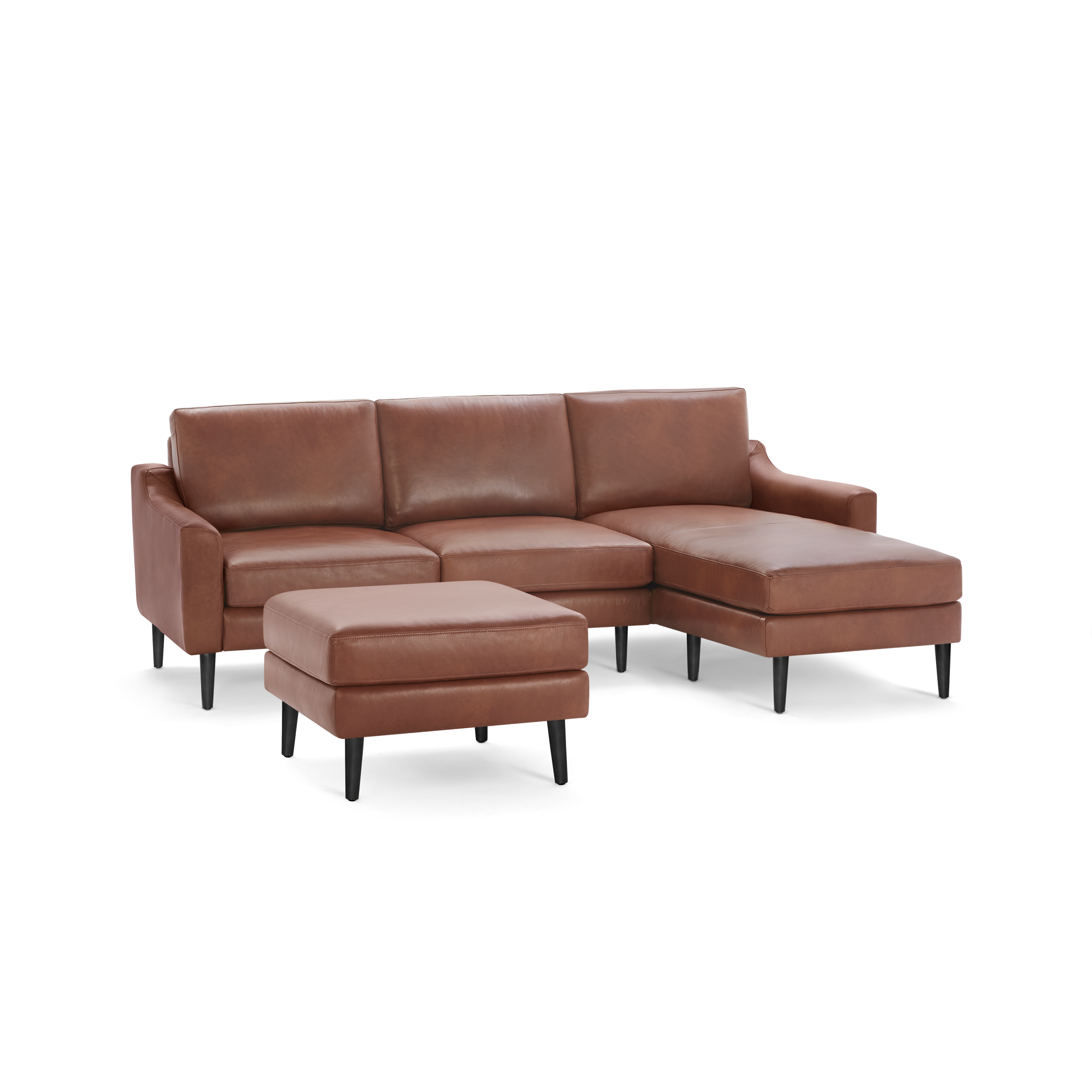 Modern brown leather sectional sofa with chaise lounge and matching ottoman, featuring black wooden legs and sleek design.