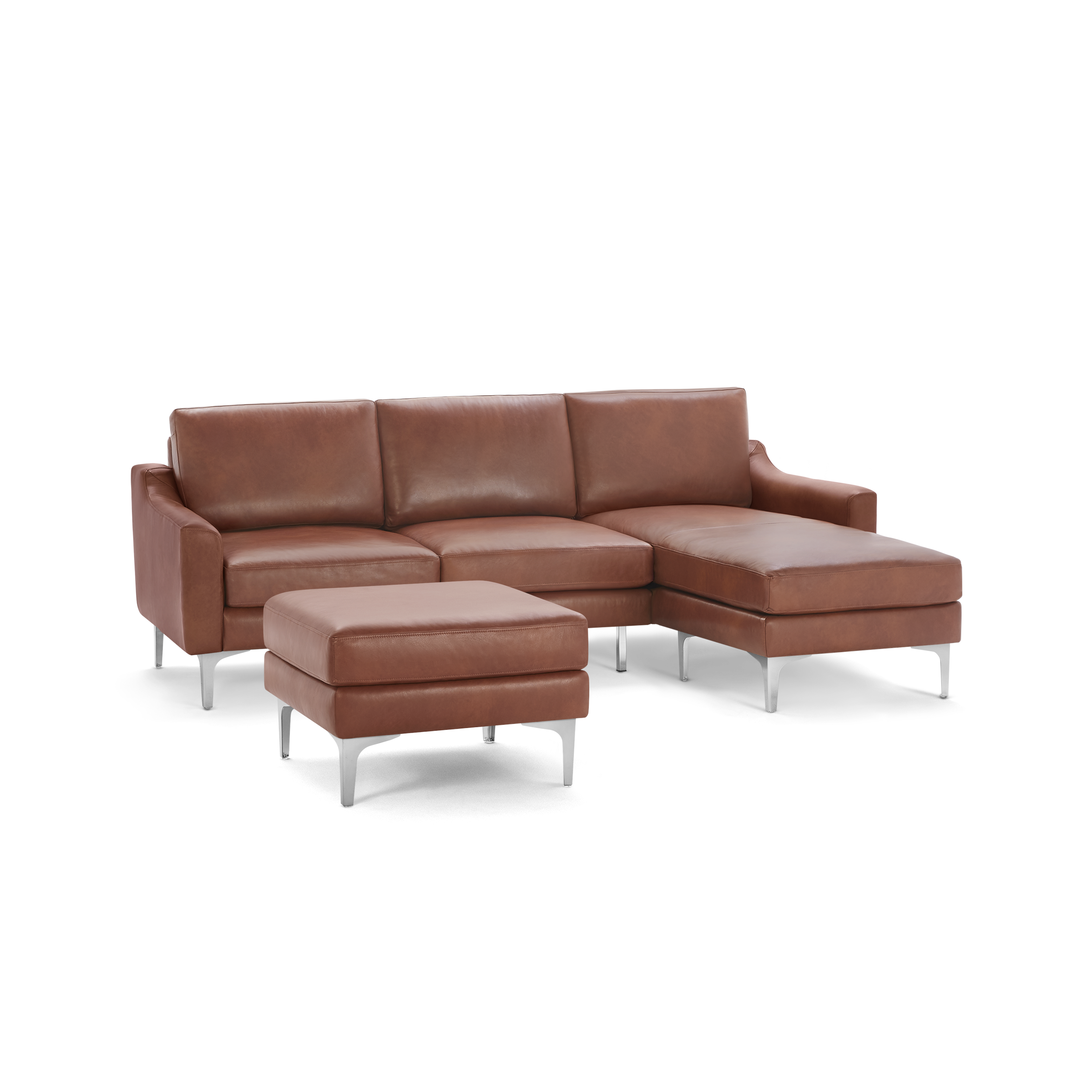 Modern brown leather sectional sofa with chaise lounge and matching ottoman, featuring sleek metal legs and plush cushions.