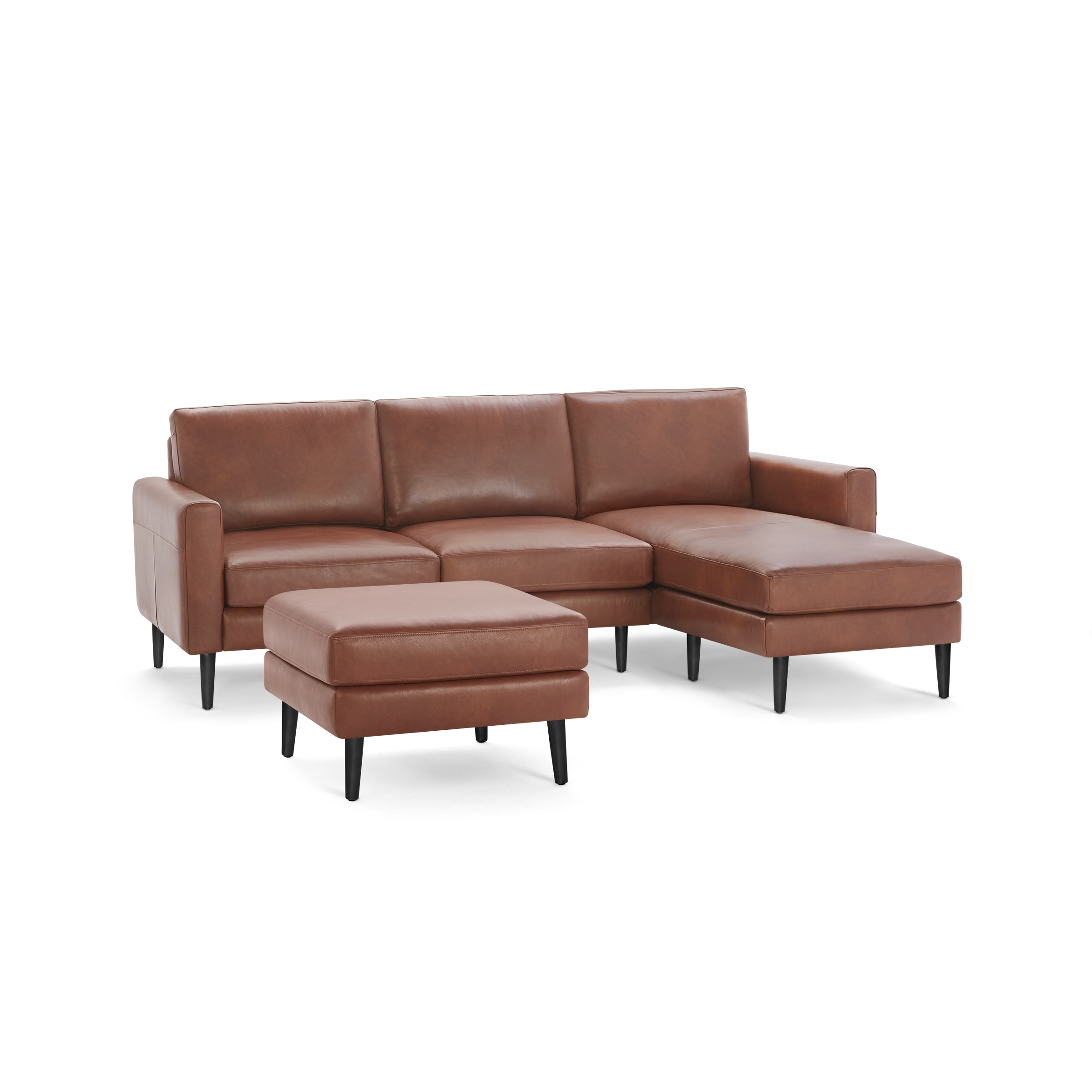 Modern brown leather sectional sofa with chaise lounge and matching ottoman, featuring sleek black legs and clean lines.