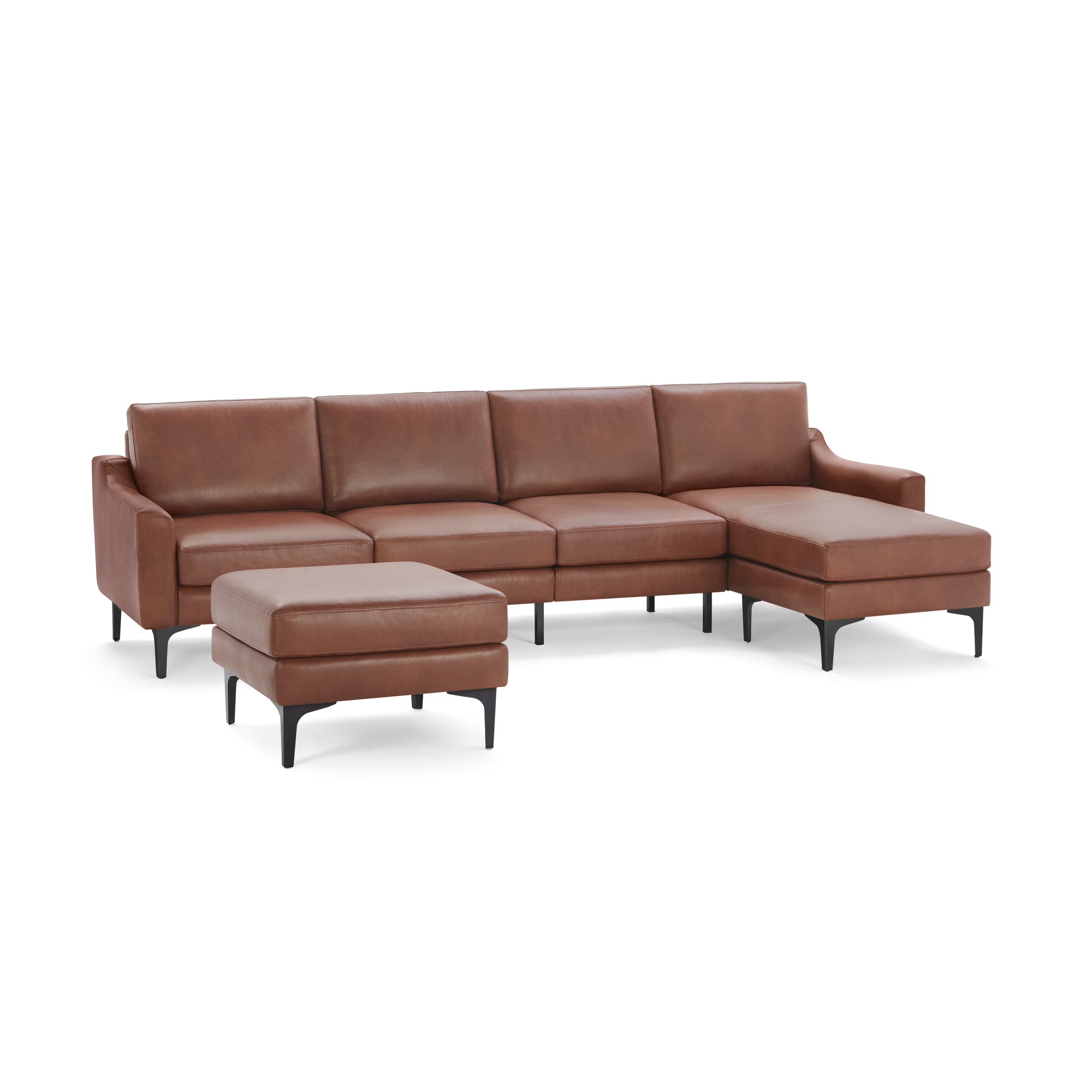 Brown leather sectional sofa with chaise lounge and matching ottoman, featuring sleek black legs and modern design.