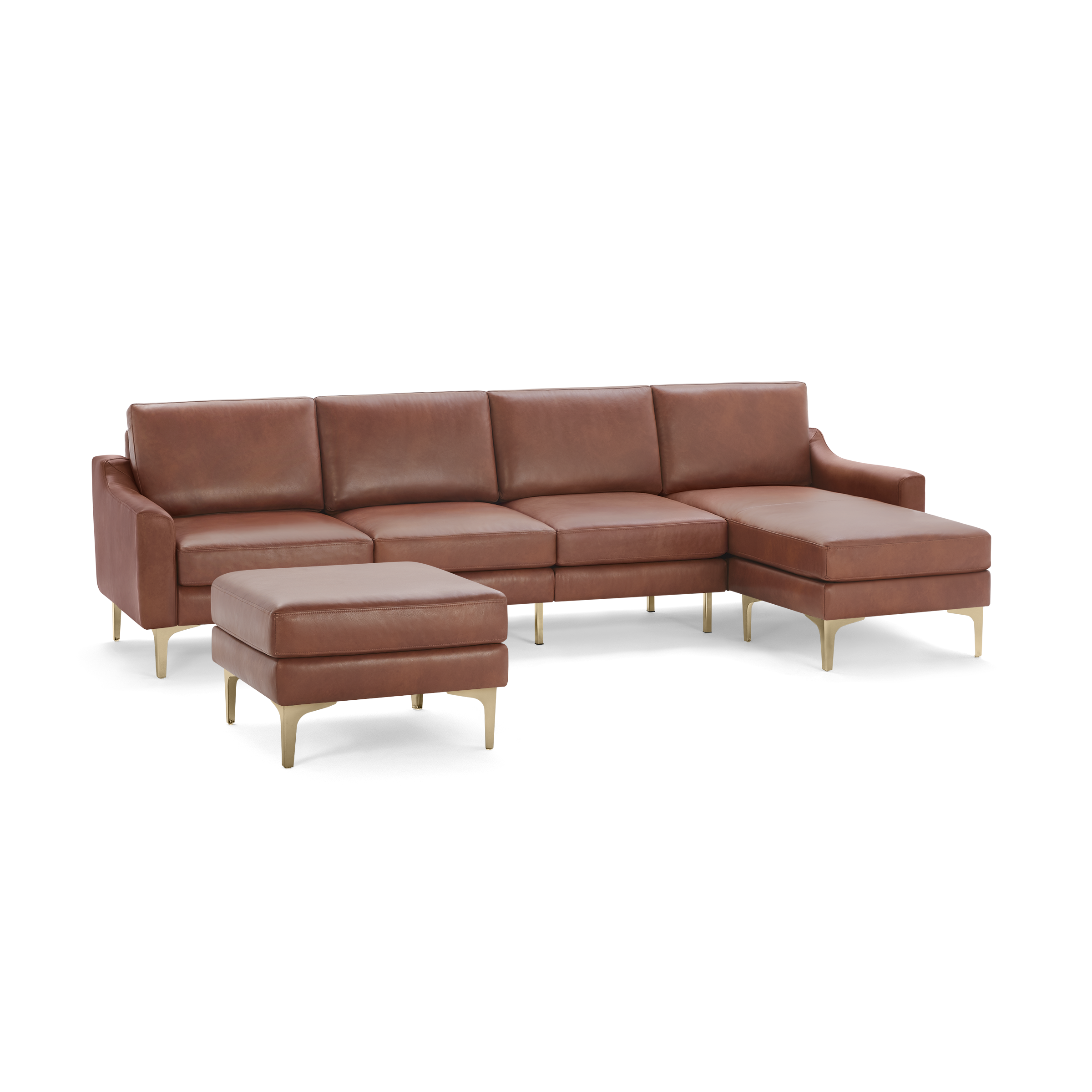 Modern sectional brown leather sofa with a matching ottoman, sleek gold legs, and a chaise lounge on the right side.
