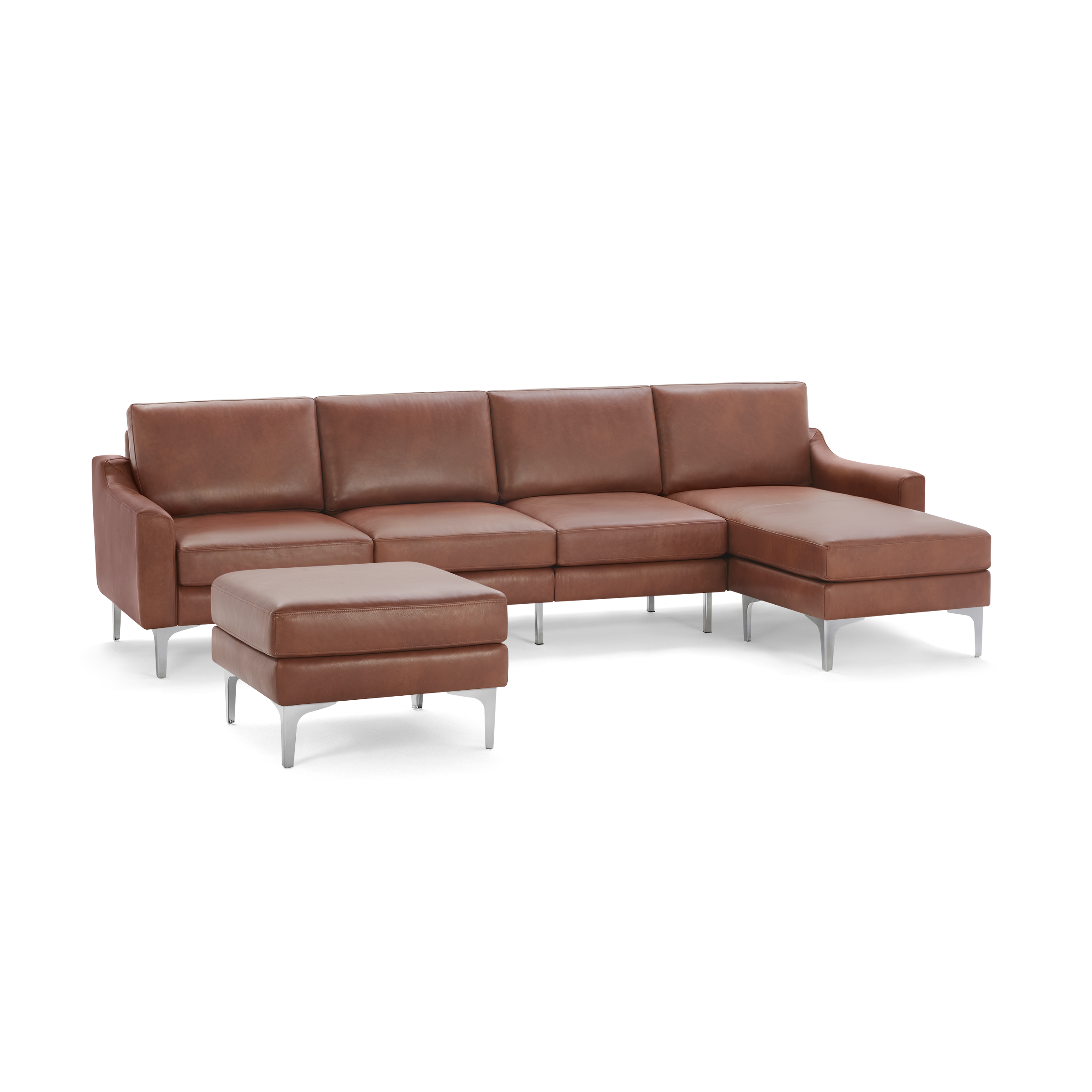 Modern brown leather sectional sofa with chaise and matching ottoman, supported by sleek metal legs.