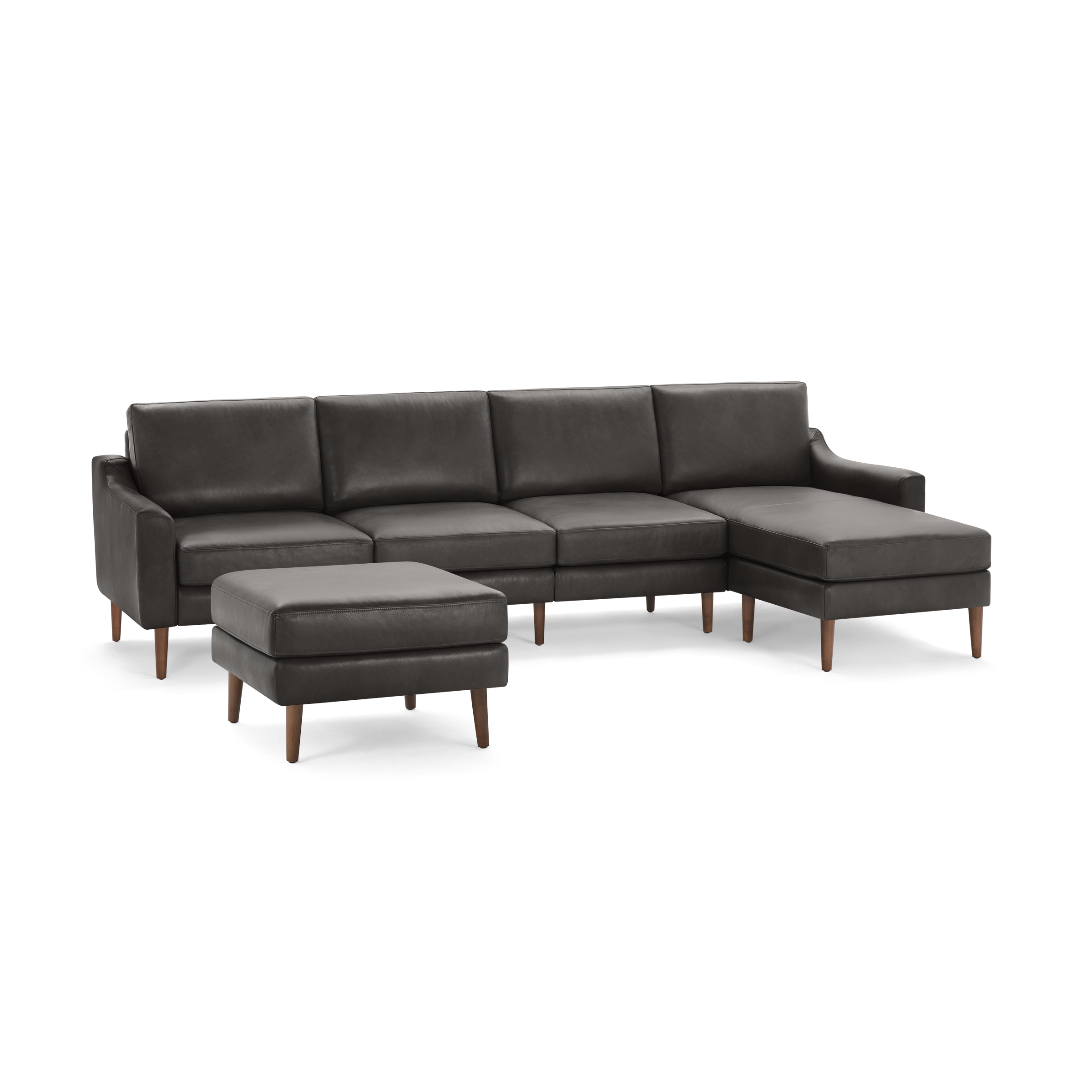 Dark gray sectional sofa with wooden legs, featuring four seats and a matching ottoman, modern and minimalist design.