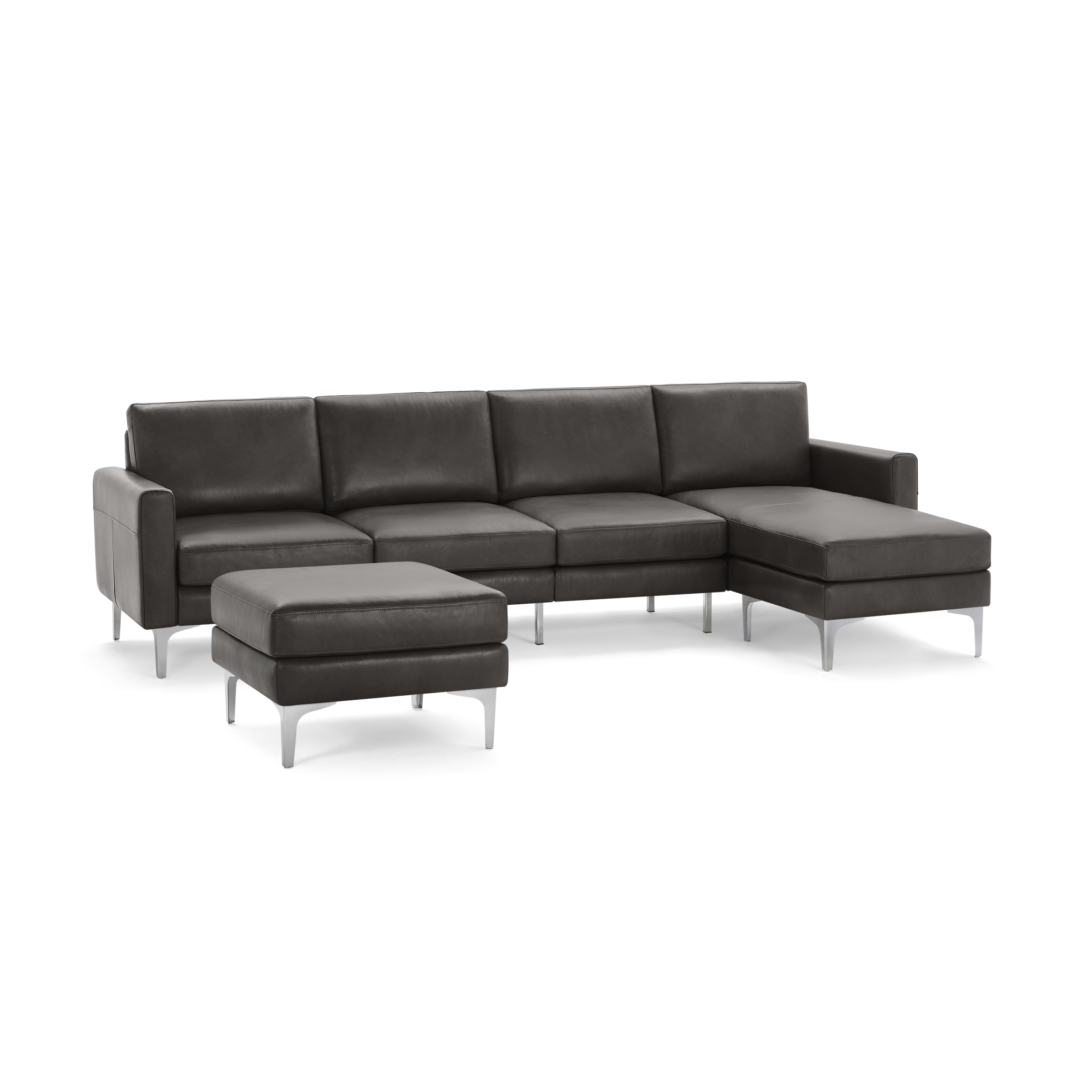 Modern dark gray sectional sofa with a matching ottoman, featuring sleek metal legs and clean lines.