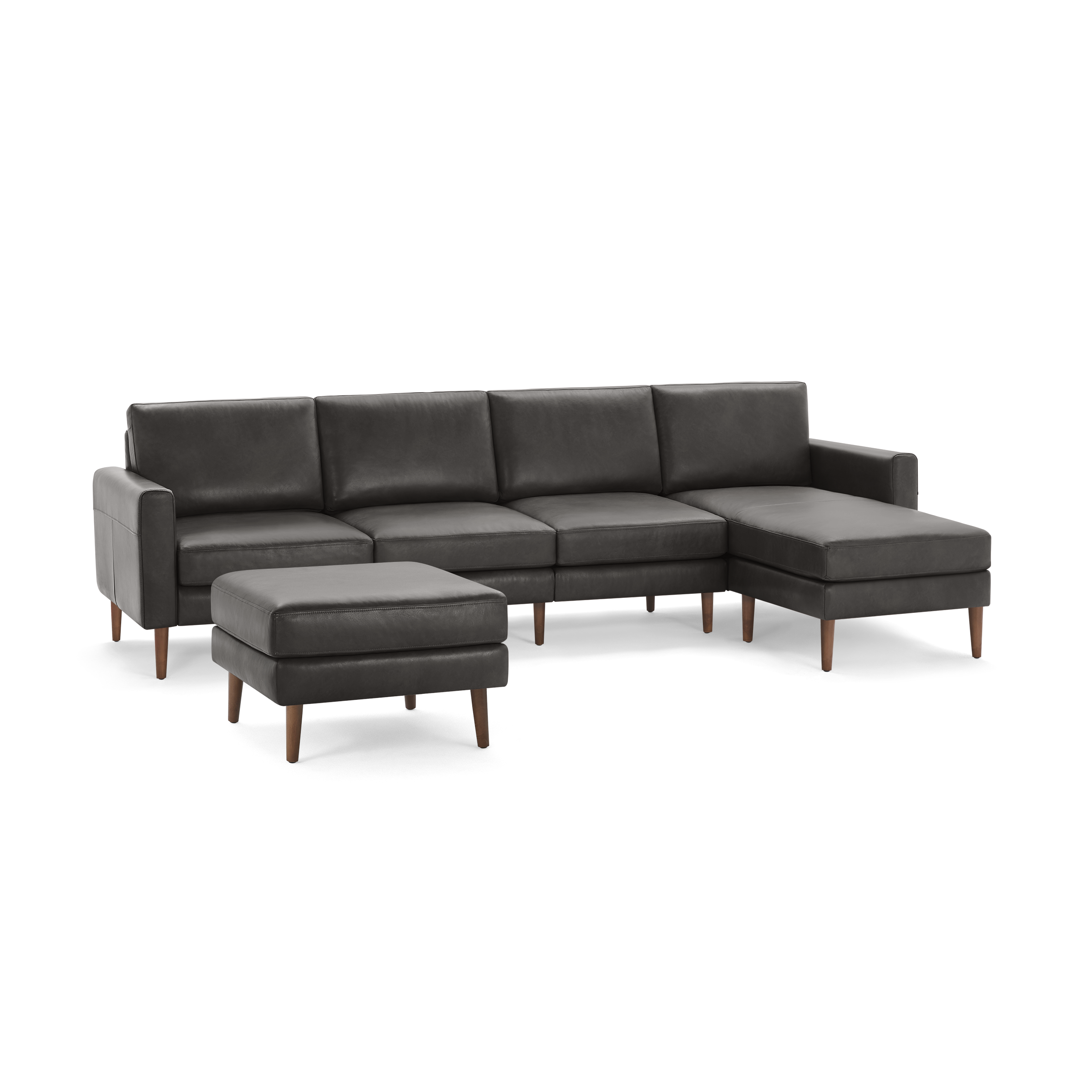 Dark gray modern sectional sofa with wooden legs and matching ottoman, featuring clean lines and cushioned seats.