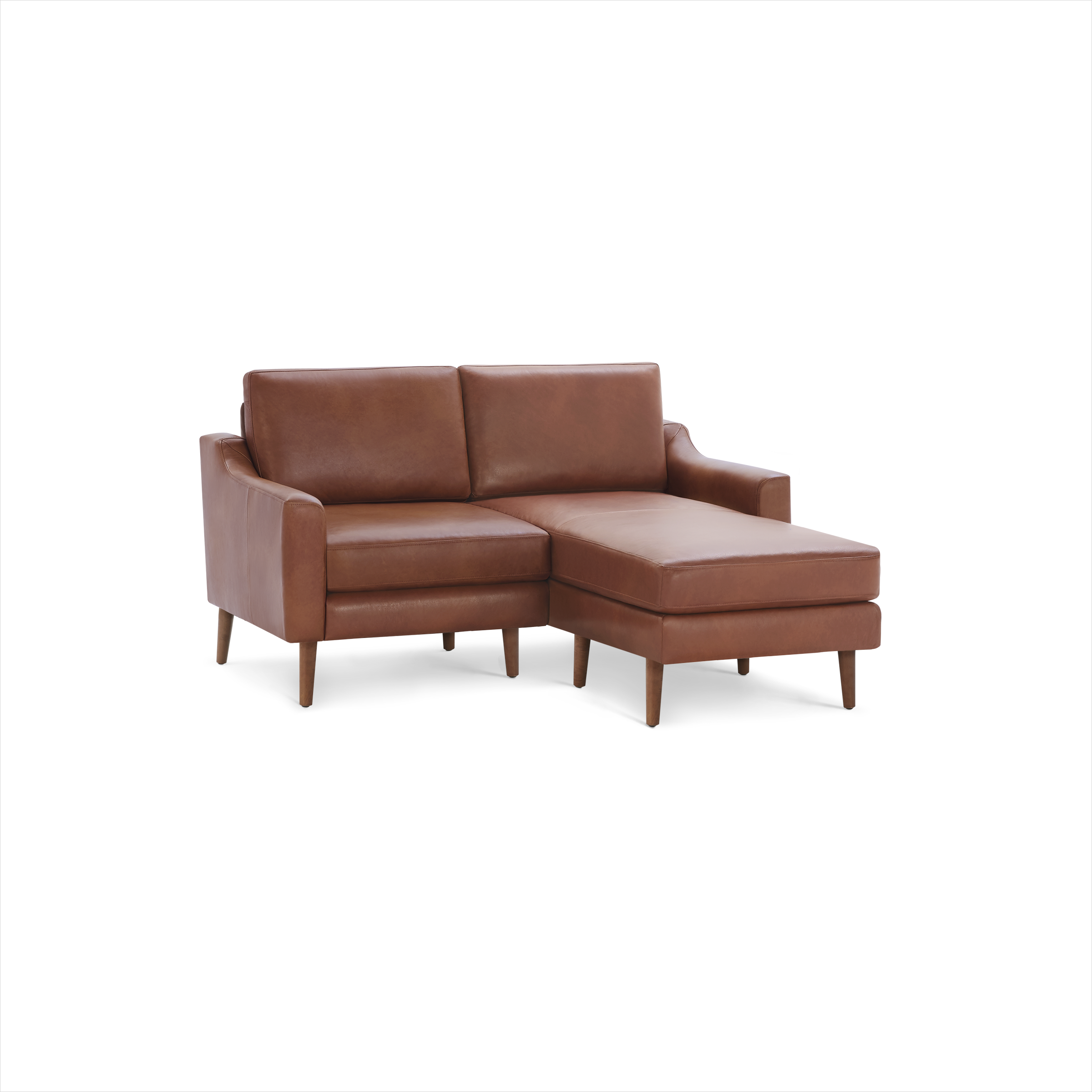 Modern mid-century style brown leather loveseat with chaise lounge and wooden legs, isolated on black background.