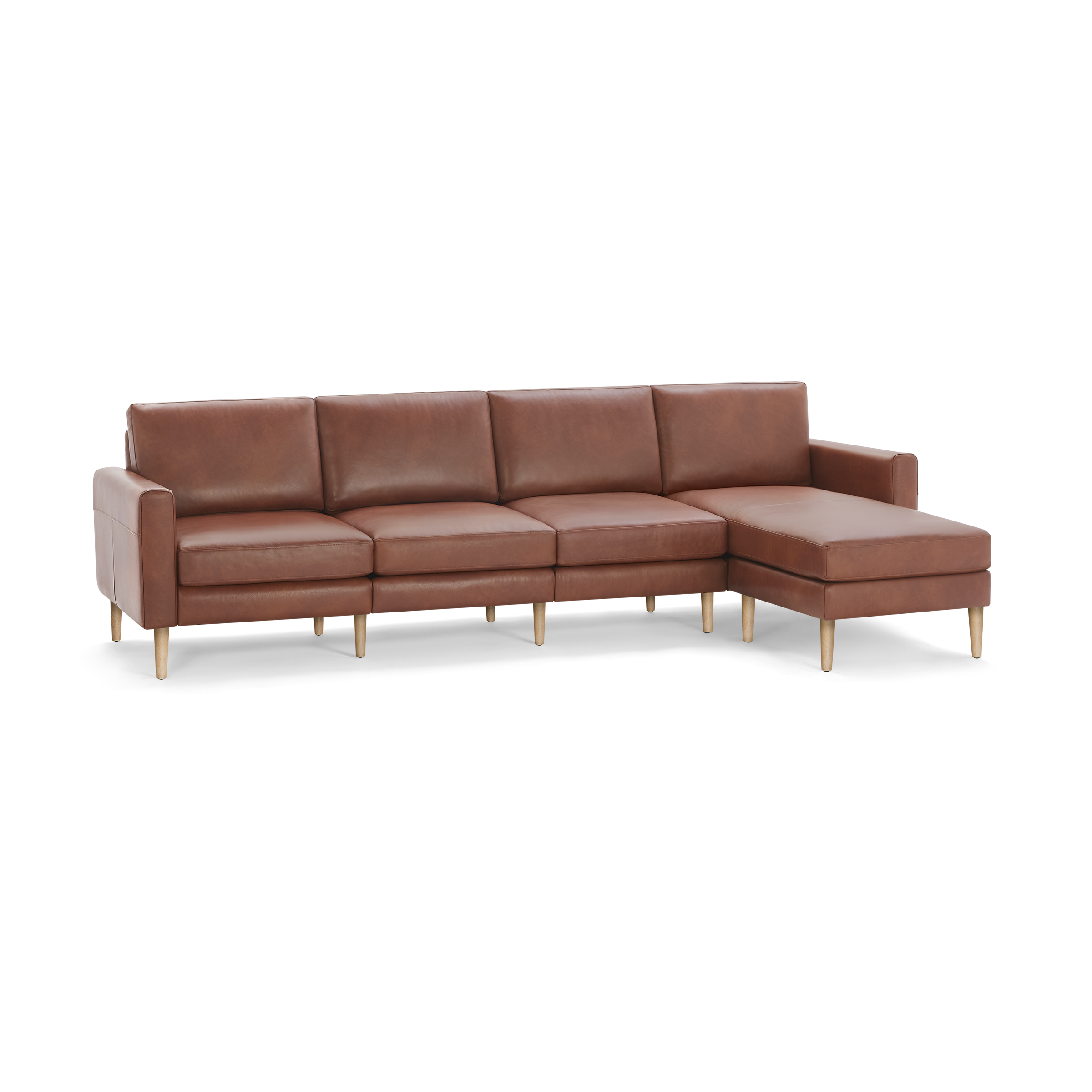 Modern brown leather sectional sofa with wooden legs, featuring three seat cushions and an extended chaise lounge on the right side.