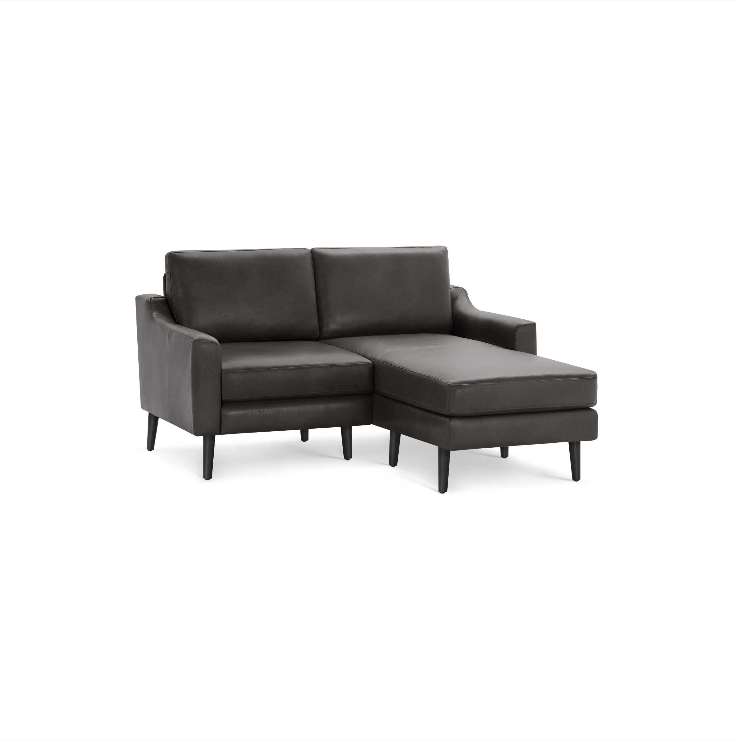 Dark gray leather upholstered sectional sofa with chaise lounge, sleek armrests, and wooden tapered legs on black background.