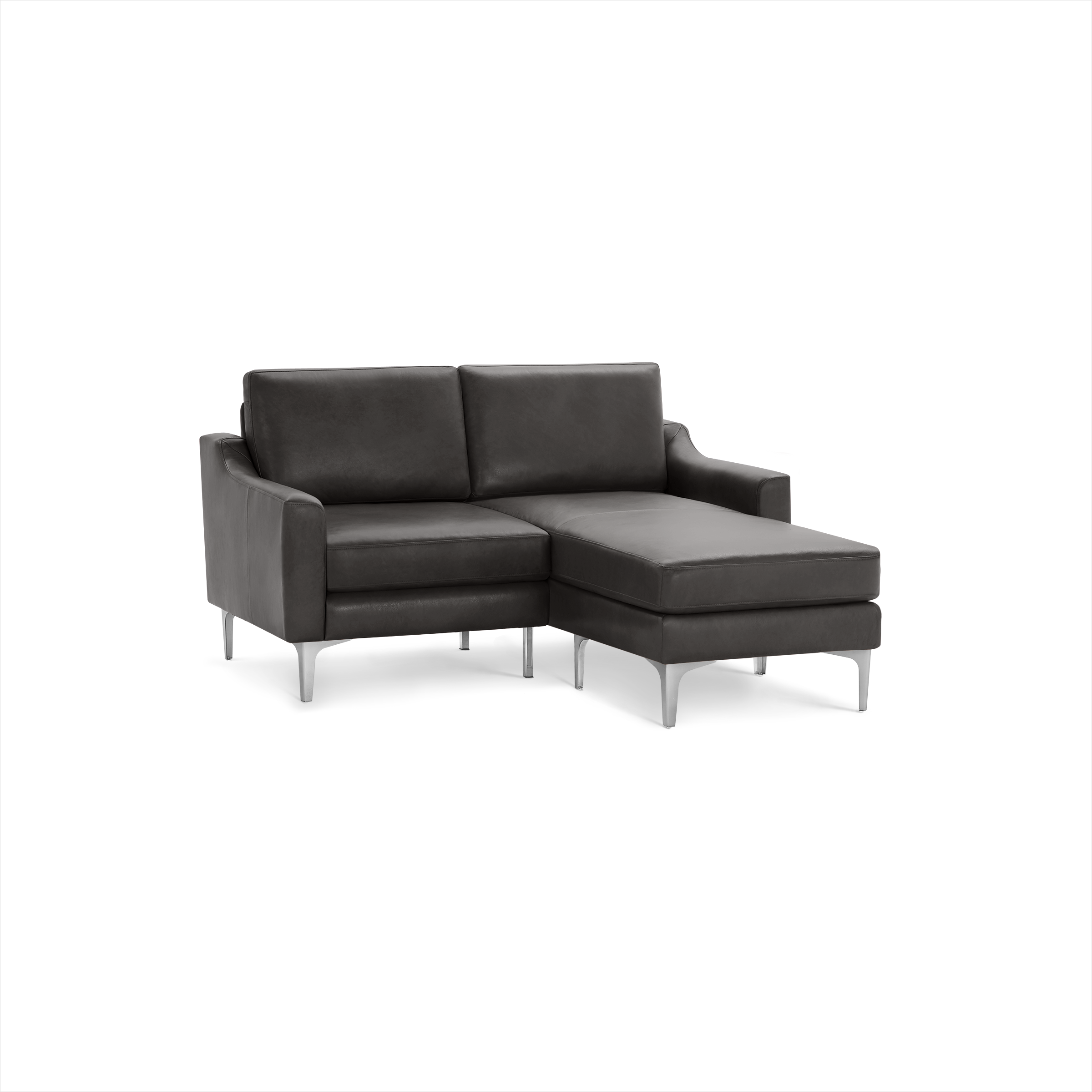 Modern dark gray leather sectional sofa with metal legs and a chaise lounge on the right side, designed for comfortable seating.