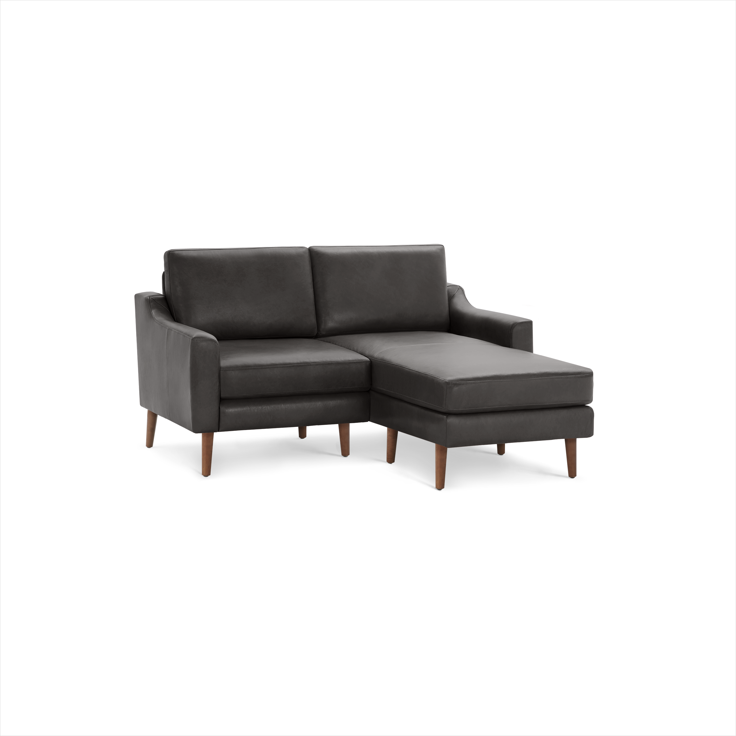 Dark gray leather sectional sofa with wooden legs, featuring a chaise lounge on the right side and plush cushions.