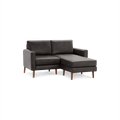 Modern dark gray leather sectional sofa with wooden legs and chaise lounge on right side, designed for compact spaces.