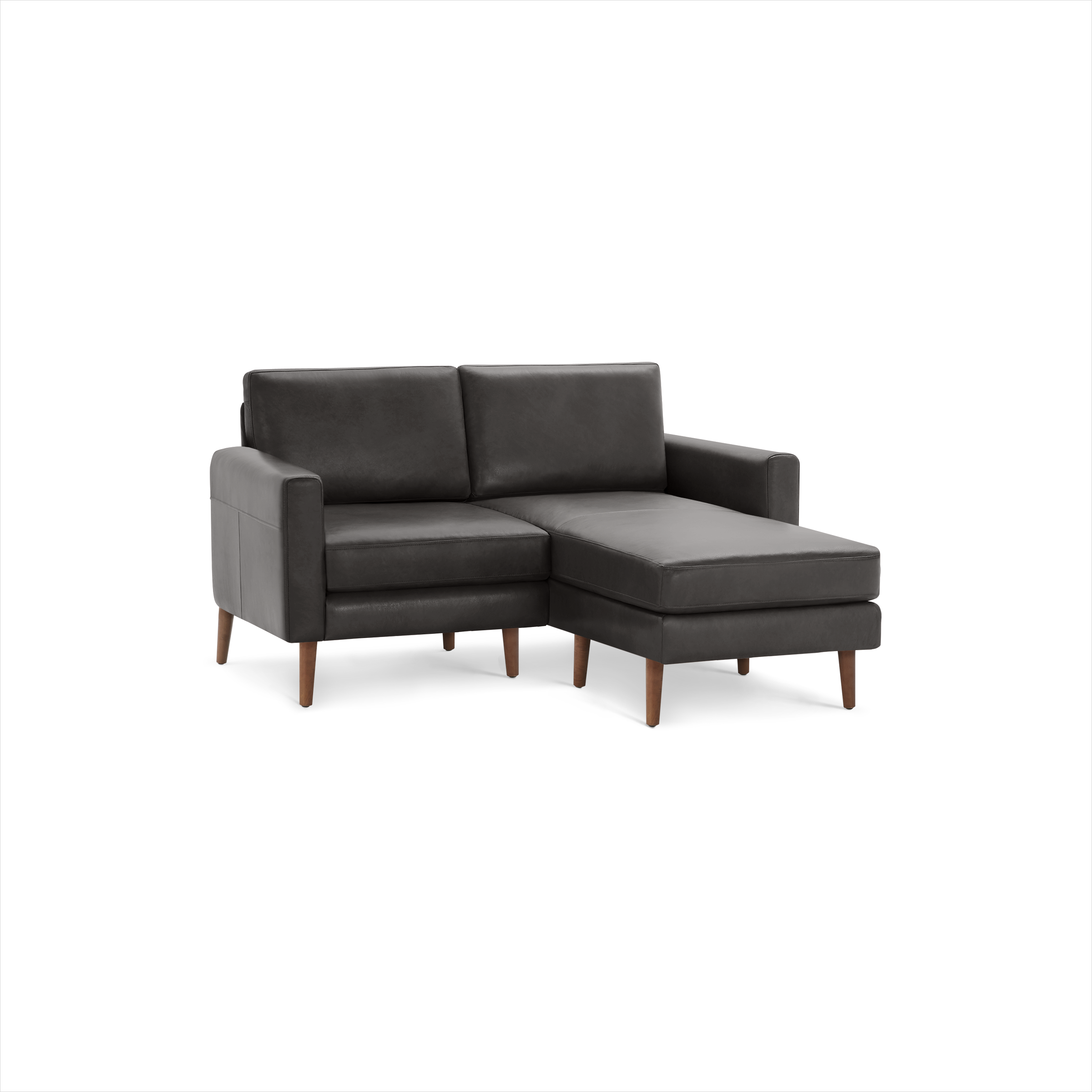 Modern dark gray leather sectional sofa with wooden legs and chaise lounge on right side, designed for compact spaces.
