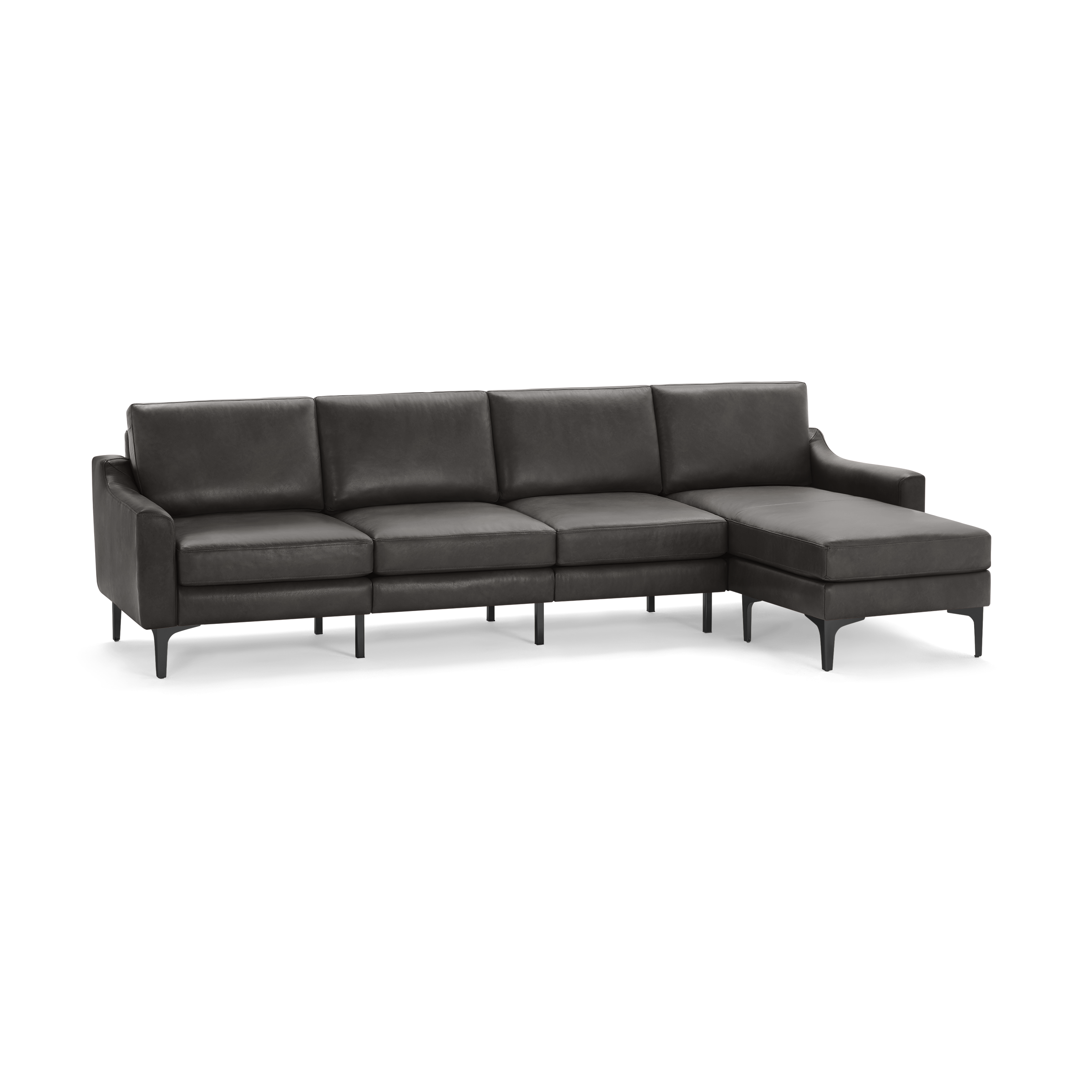 Modern dark gray leather sectional sofa with four cushioned seats and a chaise lounge on the right side, supported by black legs.