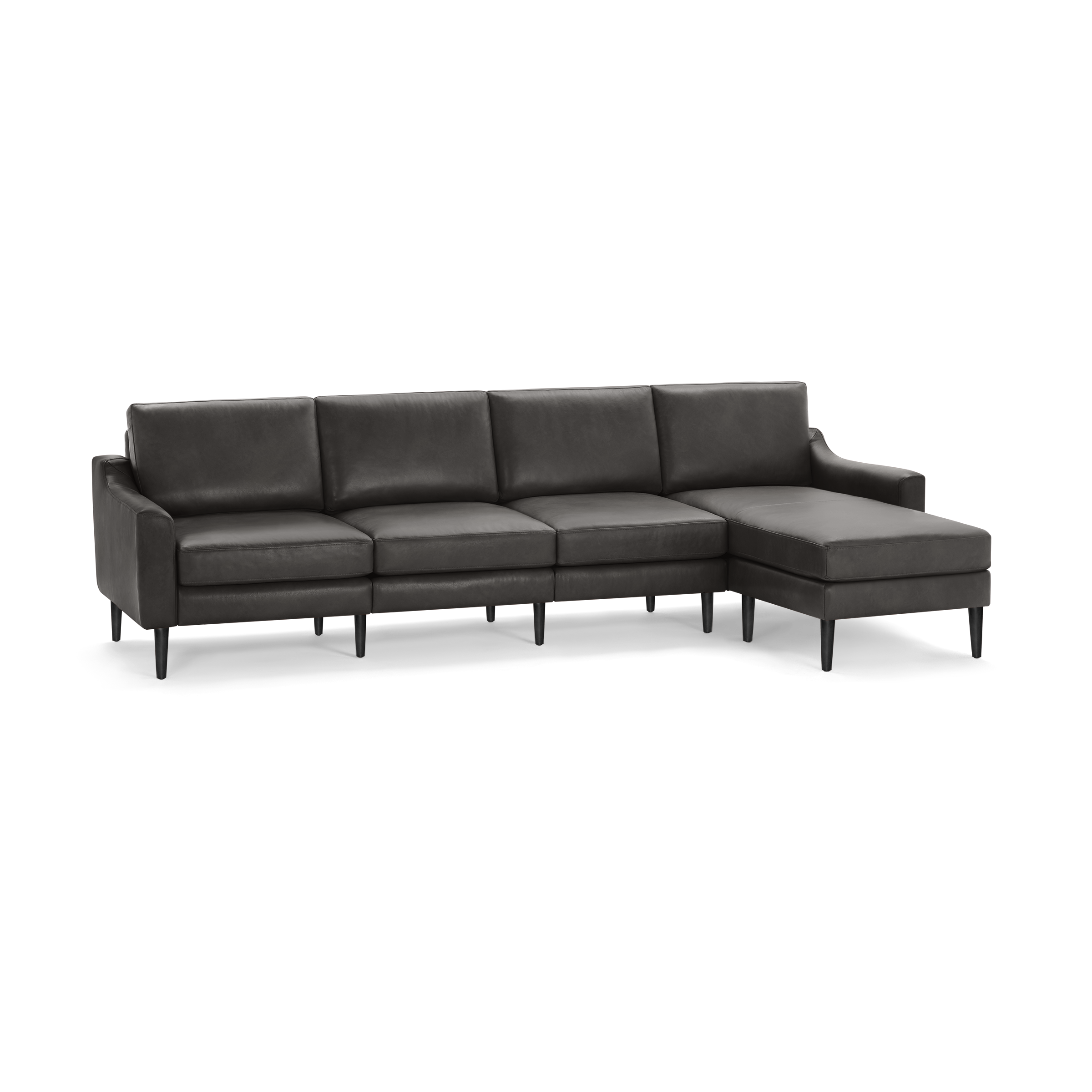 Modern dark gray leather sectional sofa with chaise lounge, slim black legs, and clean lines for a stylish living room.