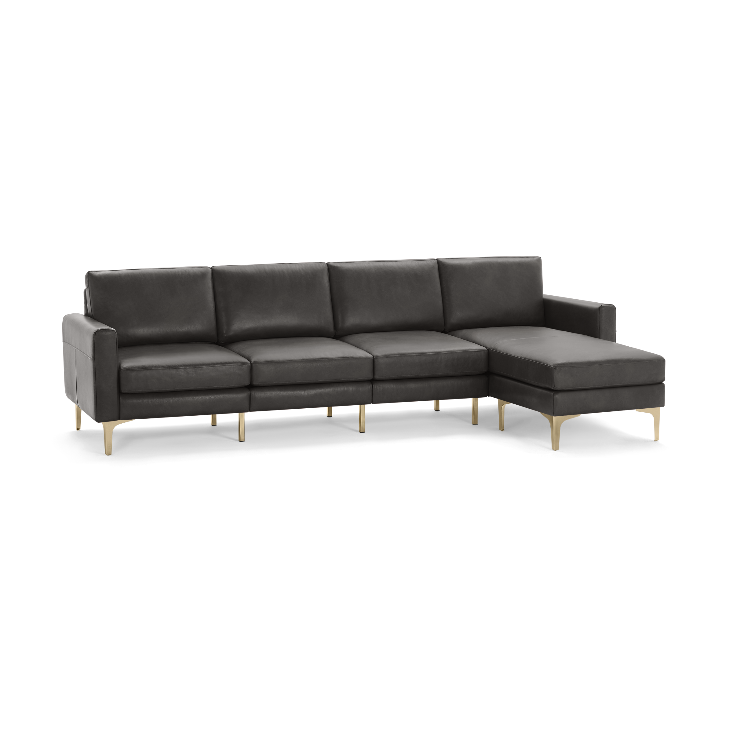 Modern dark gray leather sectional sofa with chaise lounge on right side and slim gold metal legs.