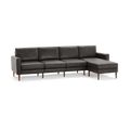 Modern dark gray leather sectional sofa with chaise lounge and wooden legs, offering sleek and comfortable seating for living rooms.