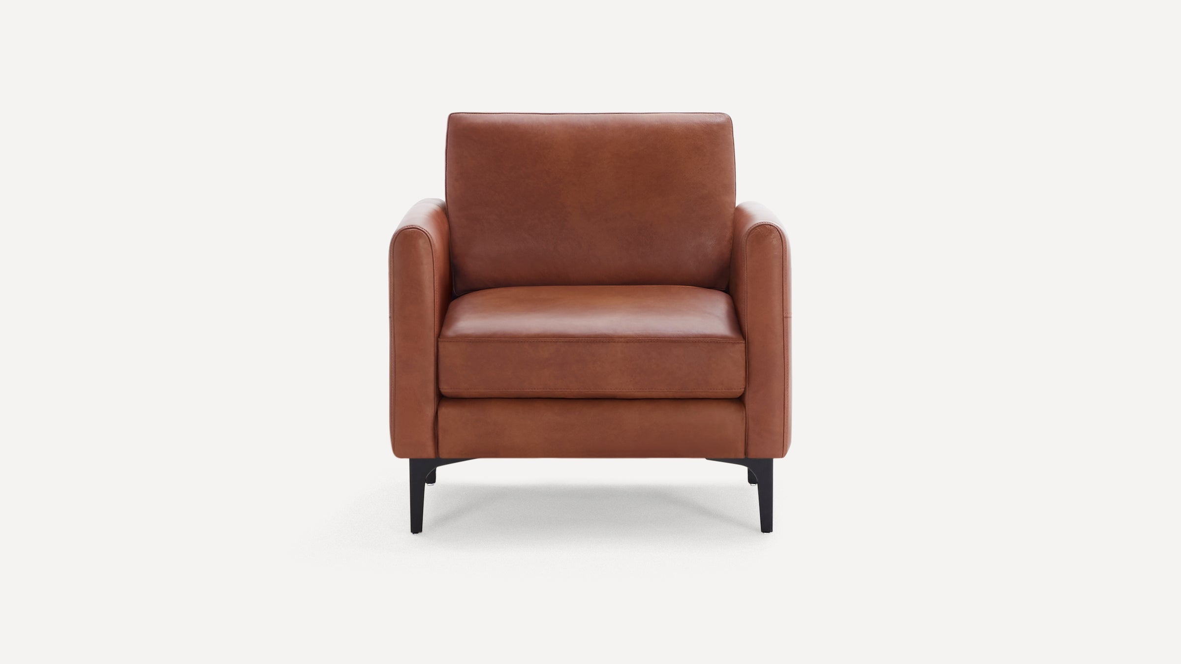 Front view of a modern brown leather armchair with black metal legs and cushioned seat and backrest.
