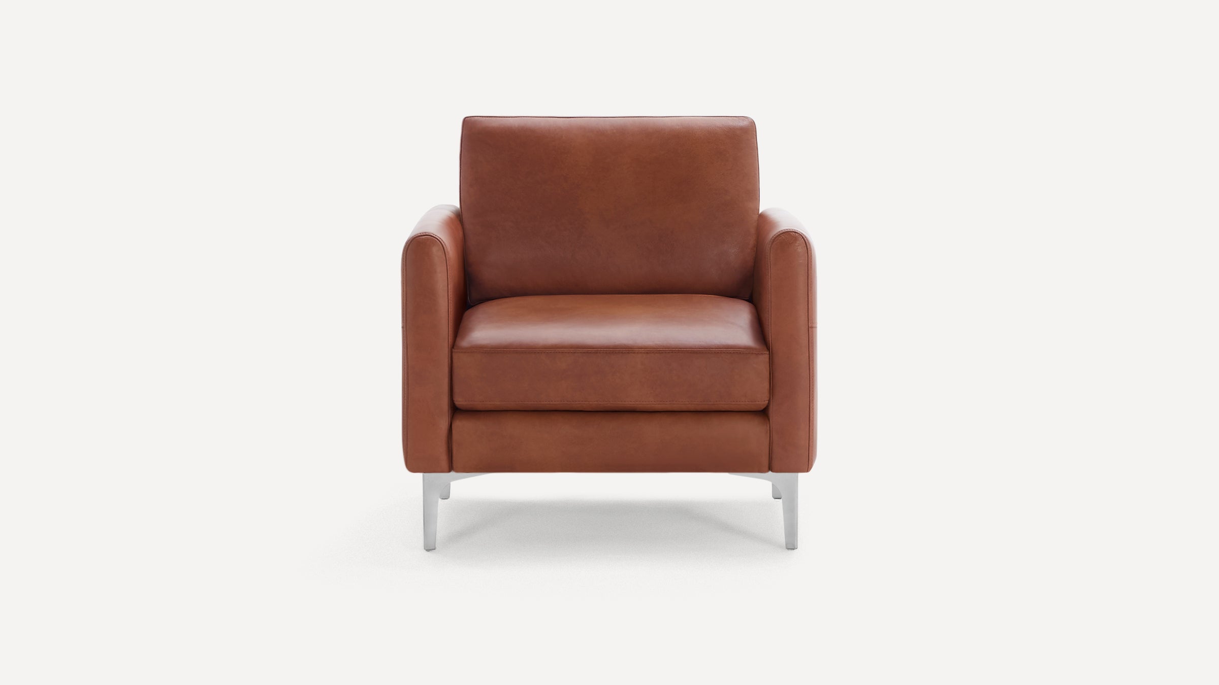 Modern single-seater armchair with smooth brown leather upholstery and sleek silver metal legs on a white background.