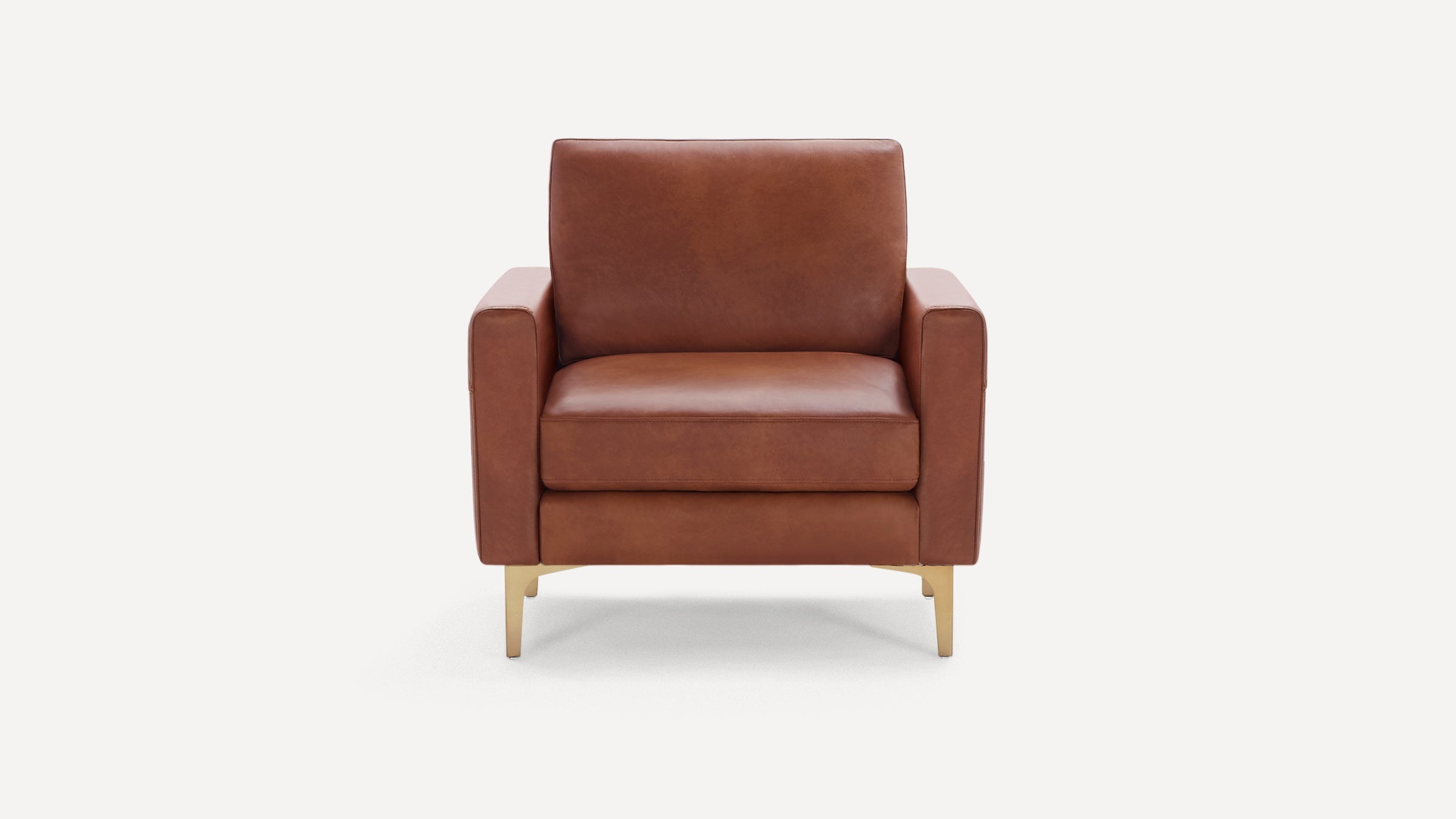 Brown leather armchair with clean lines, cushioned seat and back, and gold-colored metal legs on white background.