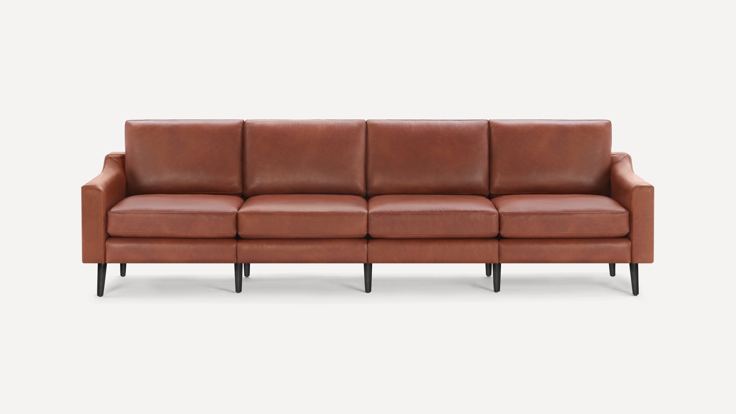 Modern four-seater brown leather sofa with clean lines, padded cushions, armrests, and black tapered wooden legs on white background.